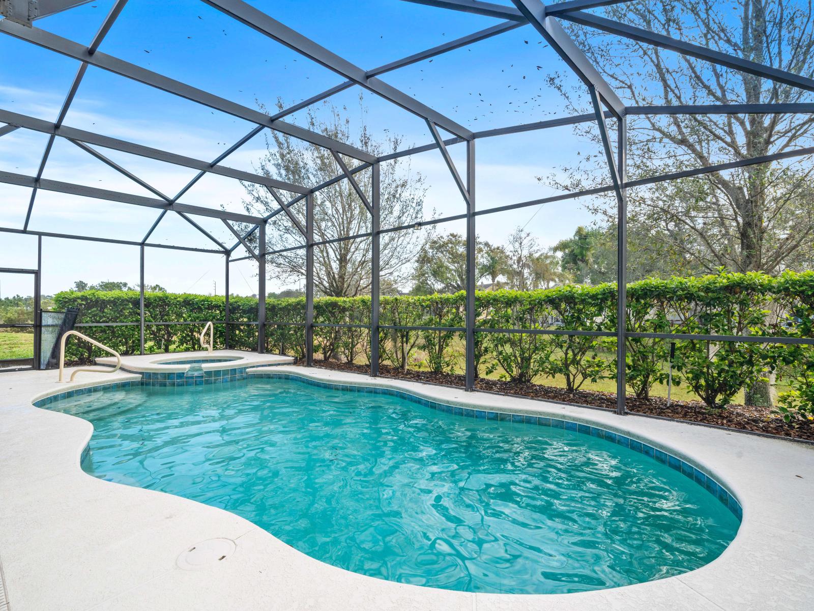 Our private pool and spa of the home offer a luxurious retreat in Davenport - Drift away into relaxation as you float in our shimmering pool or melt away stress in the bubbling spa. - Experience the epitome of luxury living with our private pool