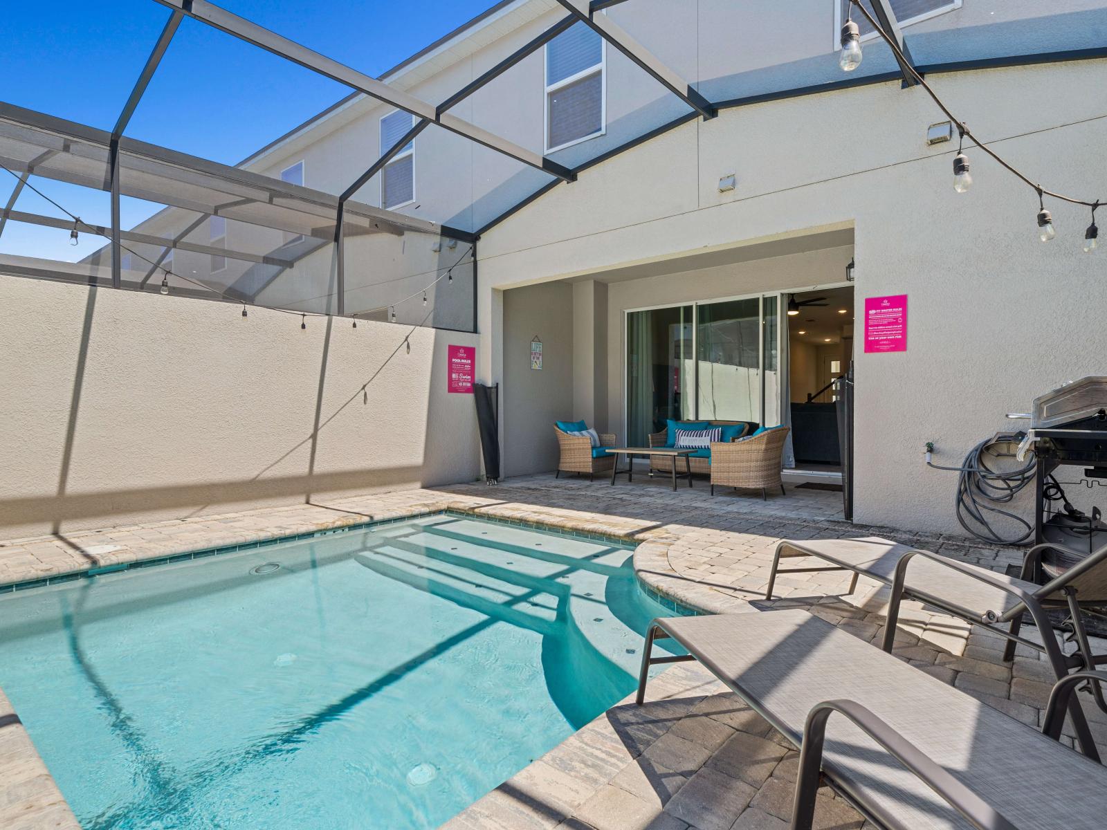 Refreshing Private Pool of the Townhouse in Kissimmee Florida - Immerse yourself in the cool elegance of pool - Lounge Chairs for relaxation - Plush seating for outdoor moments