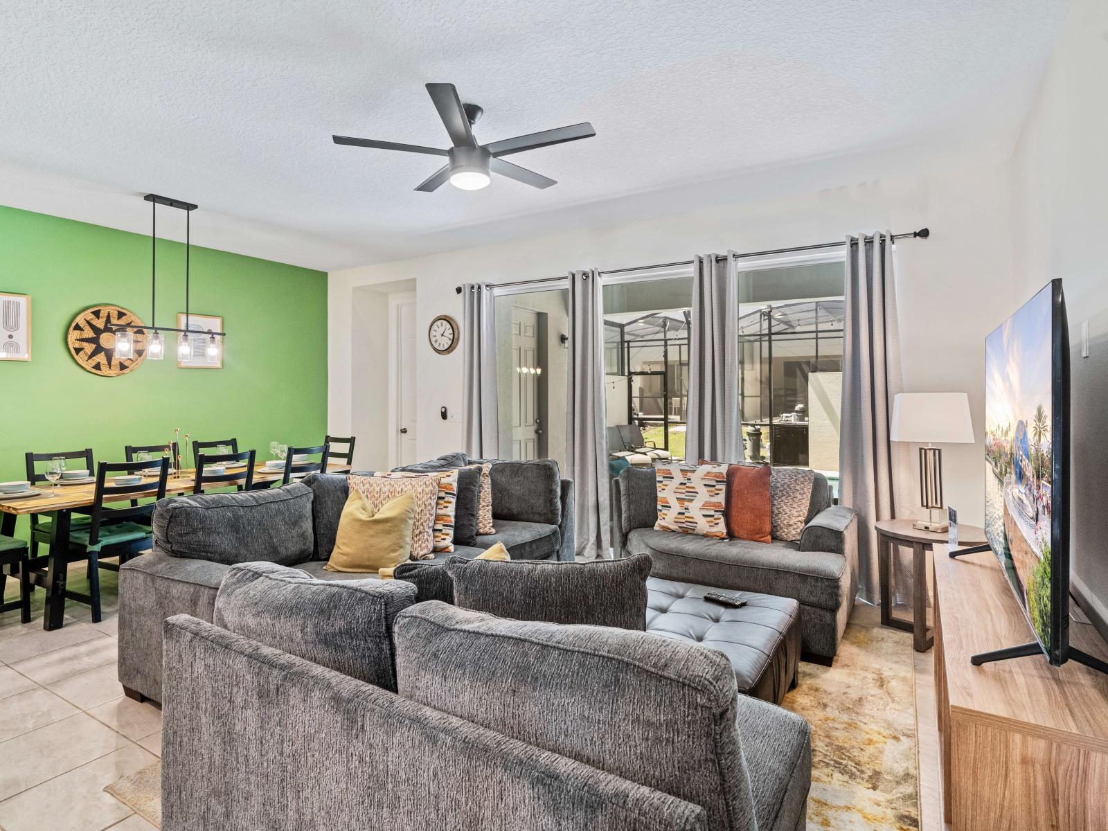 Magnificent Living Area of the Townhouse in Kissimmee Florida - Plush seating arrangements invite relaxation and gatherings - Smart TV and Netflix - Open-concept living area seamlessly connected to a stylish dining space