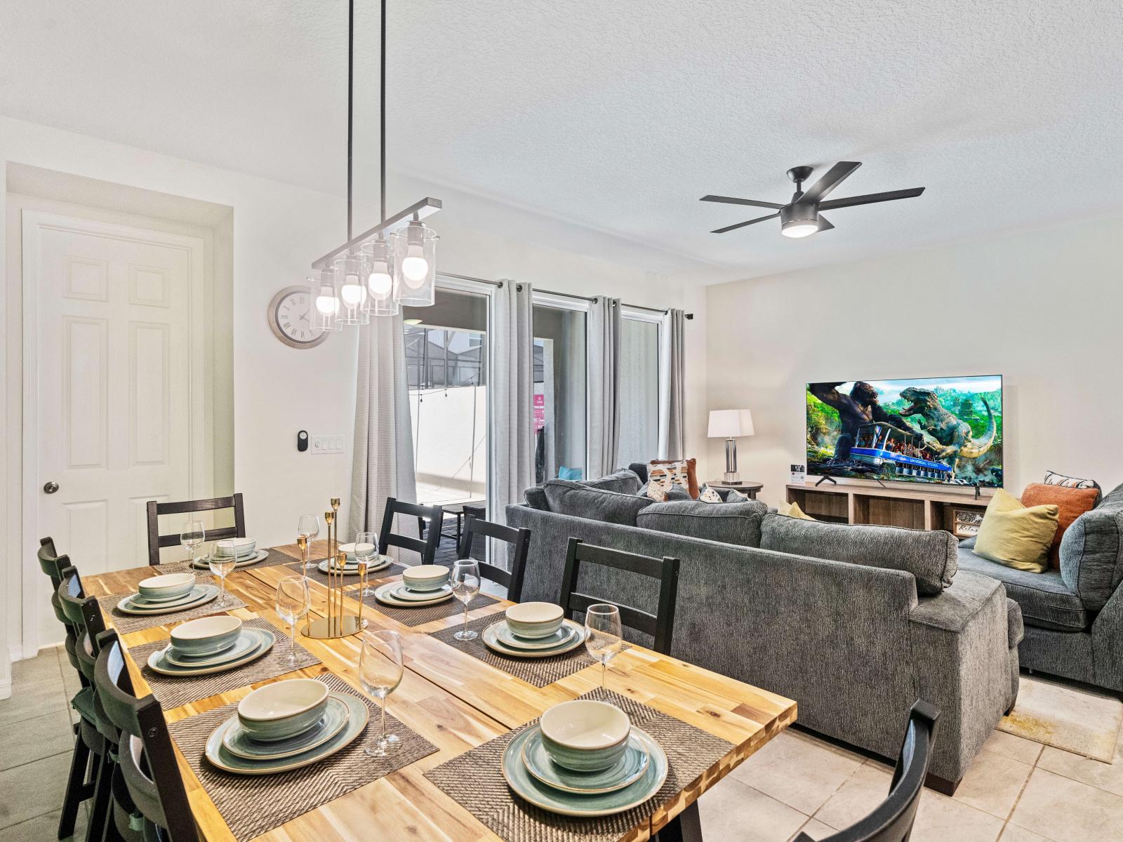 Lavish Dining Area of the Townhouse in Kissimmee Florida - 8 Persons Dining - Chic dining area featuring a stylish table and contemporary seating - Chic dining area with a statement pendant lighting