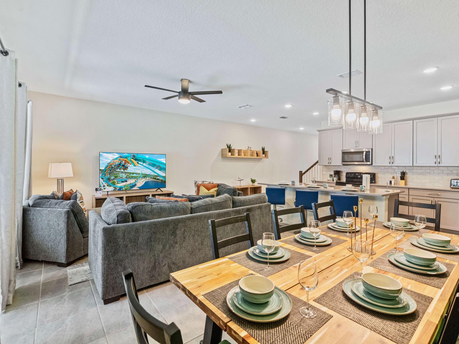 Elegant Dining Area of the Townhouse in Kissimmee Florida - Open-concept design facilitates seamless flow between living, dining, and kitchen - Smart TV and Netflix - Thoughtful lighting design creates a warm and inviting ambiance