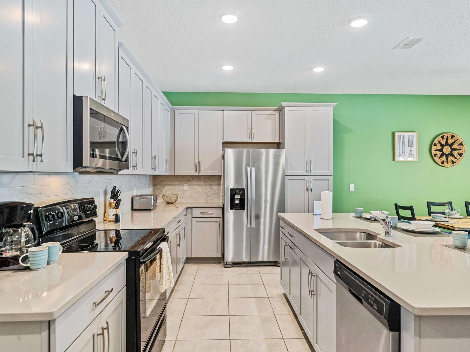 Clean Kitchen of the Townhouse in Kissimmee Florida - Full equipped - Kitchen with sleek, stainless steel appliances - Contemporary design with clean lines and minimalist aesthetics