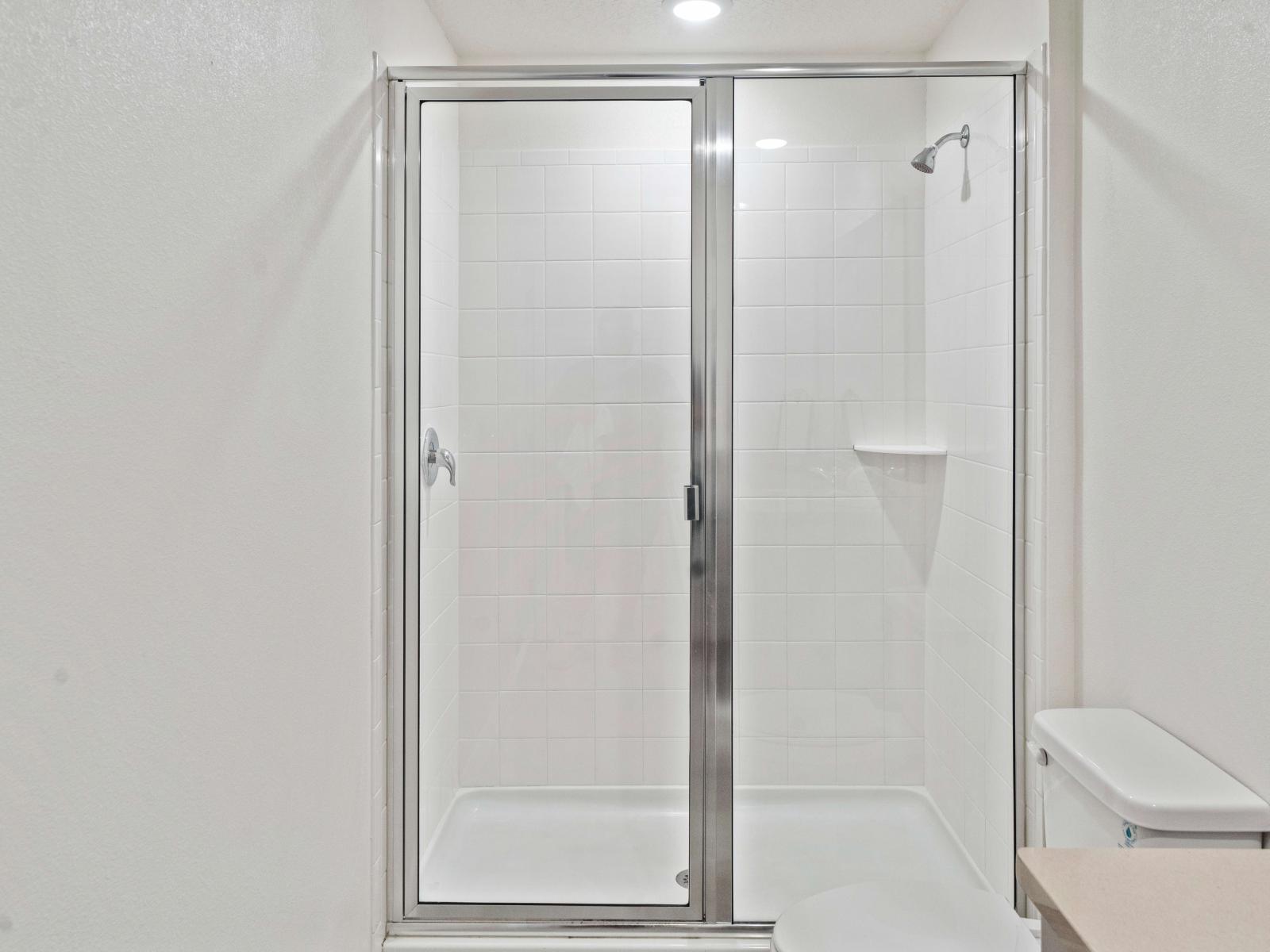 tiled Bathroom of the Townhouse in Kissimmee Florida   - Walk in shower area - Clean bathroom - Contemporary fixtures for a touch of indulgence