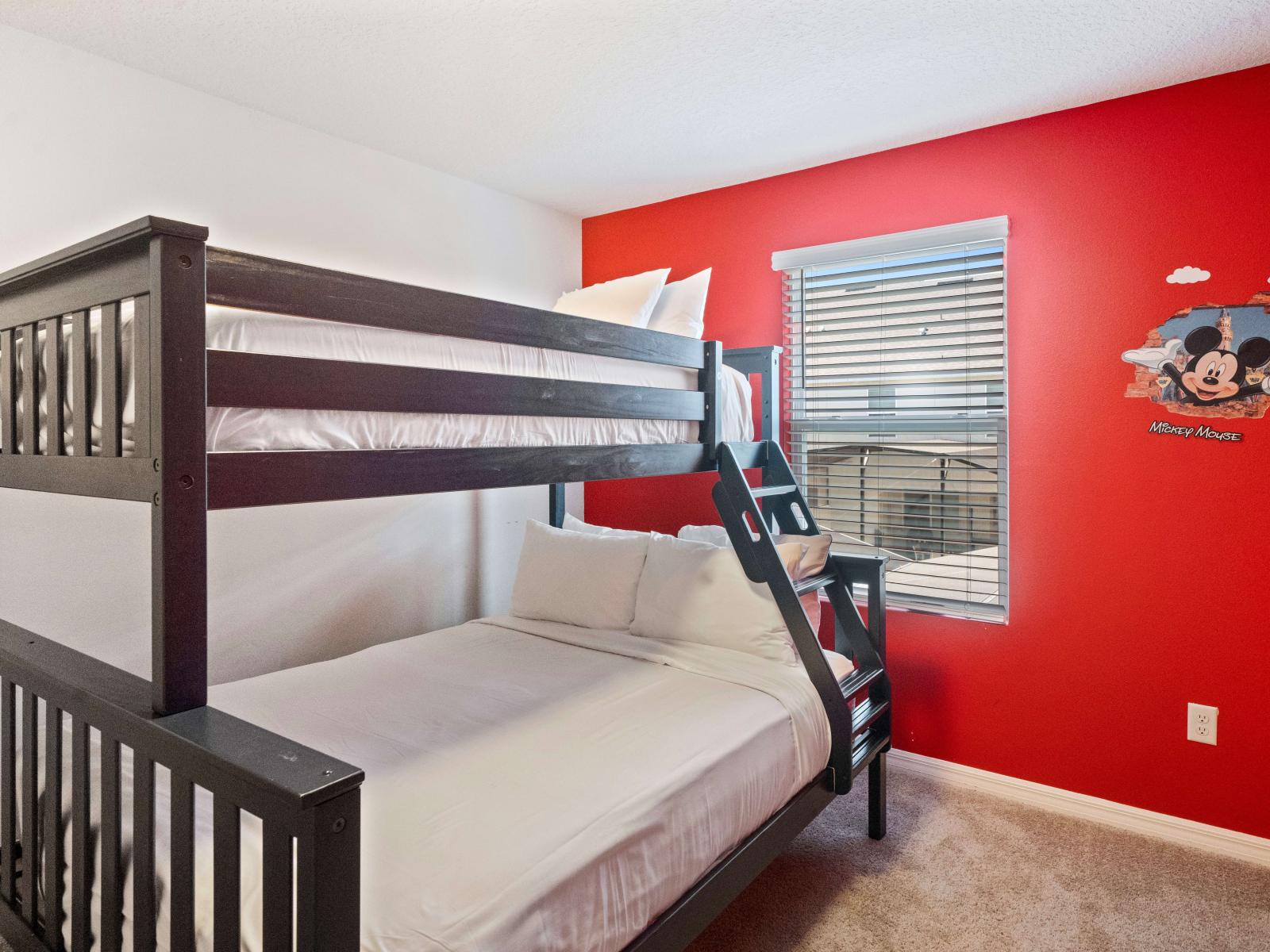 Micky Themed Bedroom of the Townhouse in Kissimmee Florida - With a double bed and a single bed - Inviting ambiance with soft lighting and tasteful decor