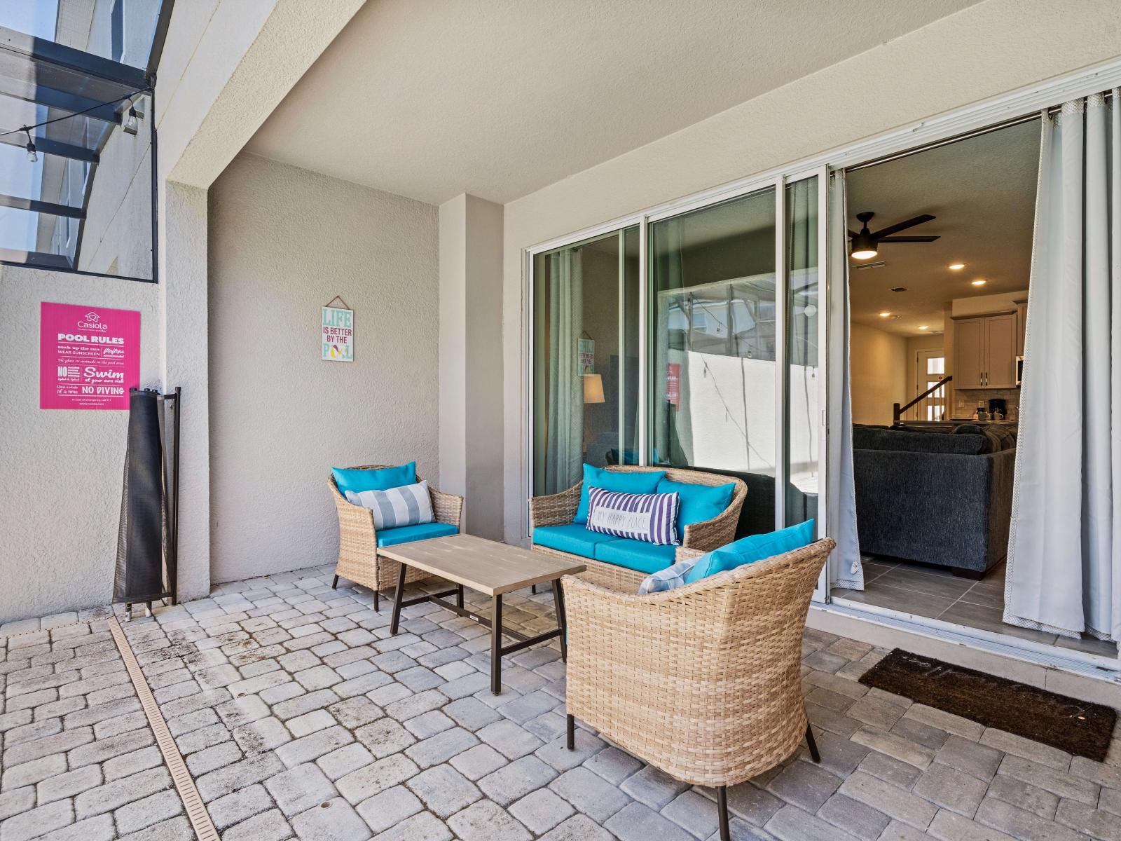 Outdoor seating of the Townhouse in Kissimmee Florida - Cozy seating area conducive to relaxation and socializing - Stunning Pool Views - Amazing Environment