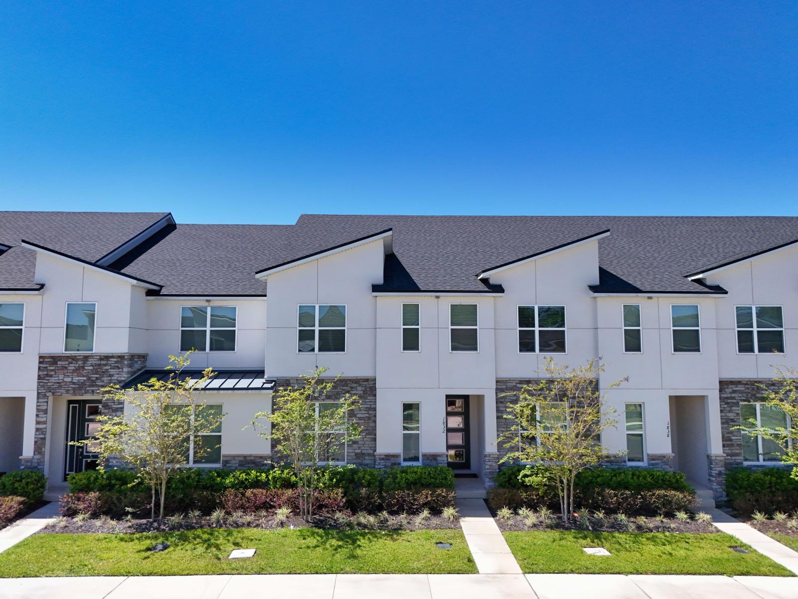 Townhouse exterior in Kissimmee Florida - A unique building with innovative and elegant architecture - Plants for touch of nature