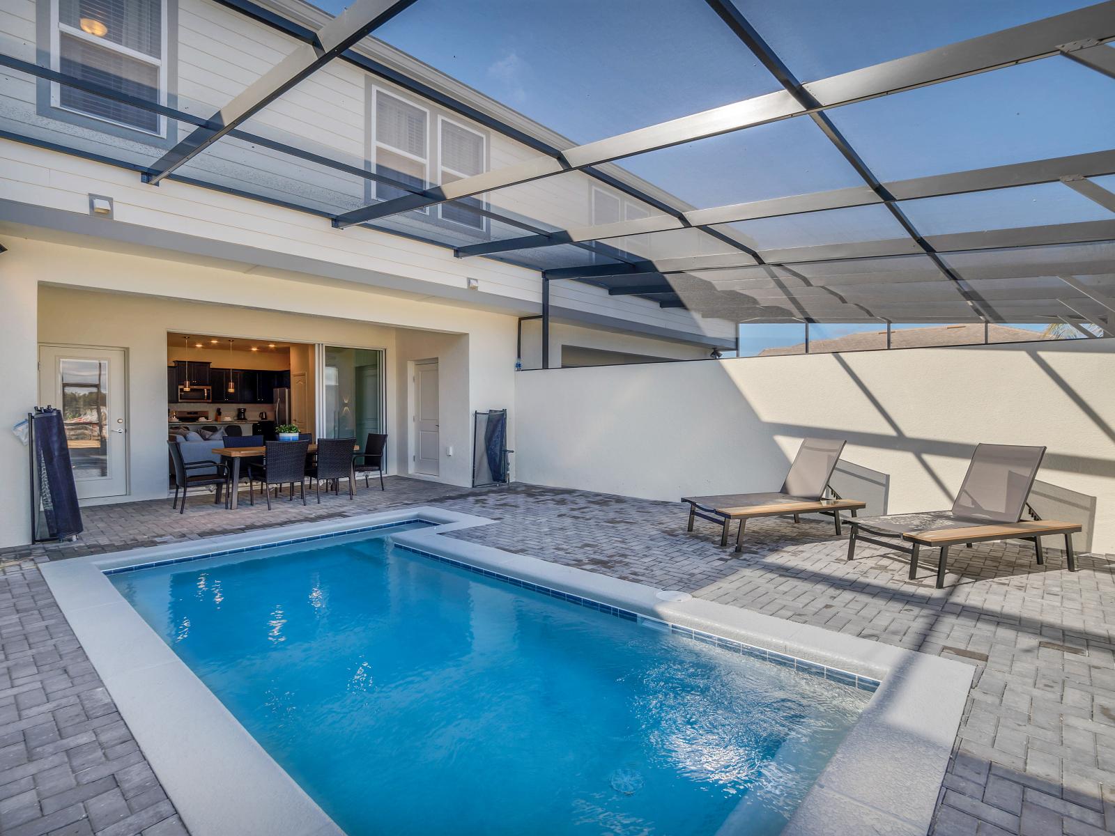 Stunning private pool of the townhouse in Davenport Florida - Immerse yourself in the cool elegance of pool - Unwind with a dip in our chic and stylish pool area - Experience ultimate relaxation in poolside paradise - Lounge chairs for relaxation