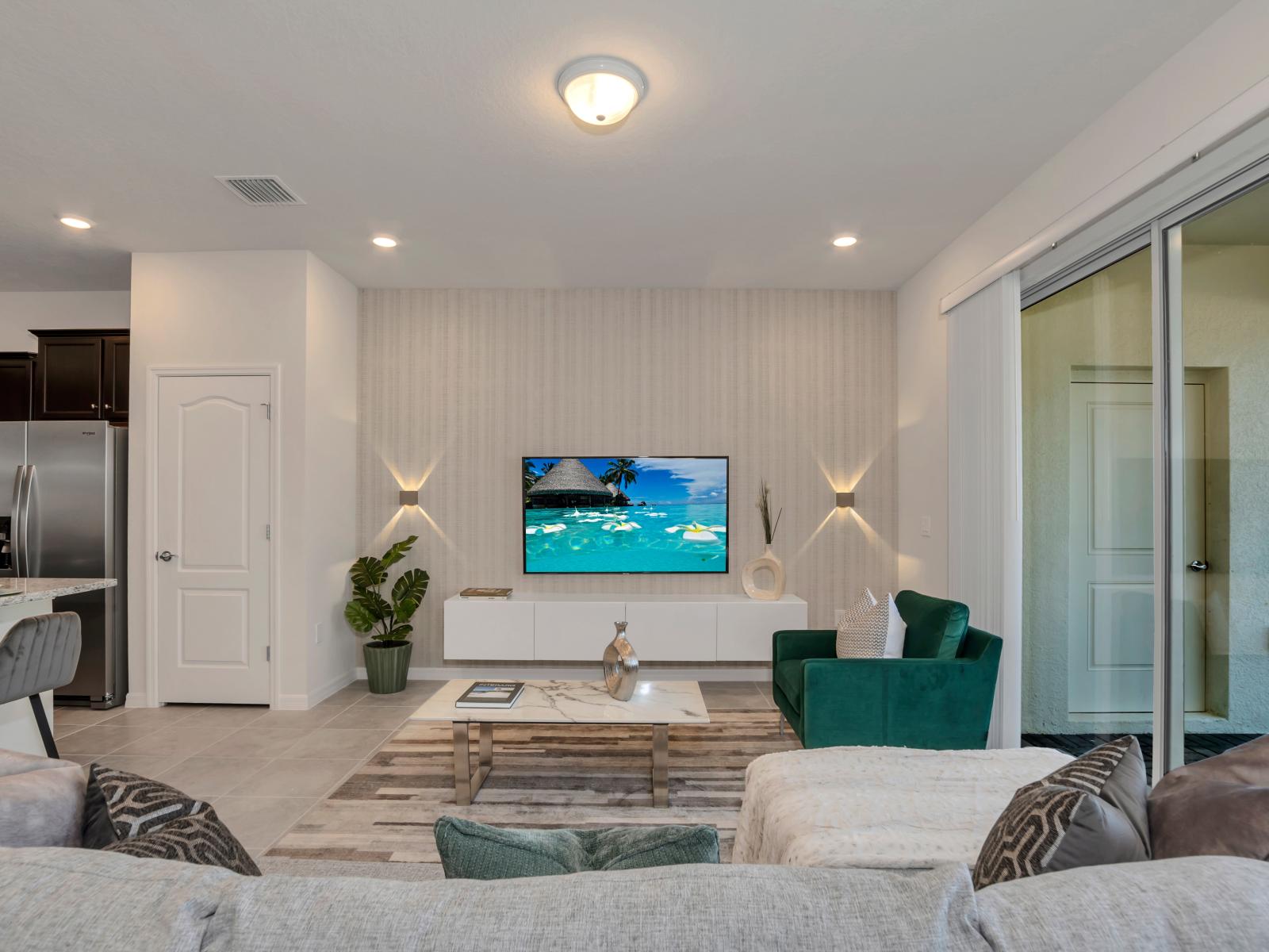 Enchanting living area of the townhouse in Davenport Florida - Smart TV for entertainment - Chic and contemporary living room design with clean lines and modern furnishings - Comfy sofas for relaxation