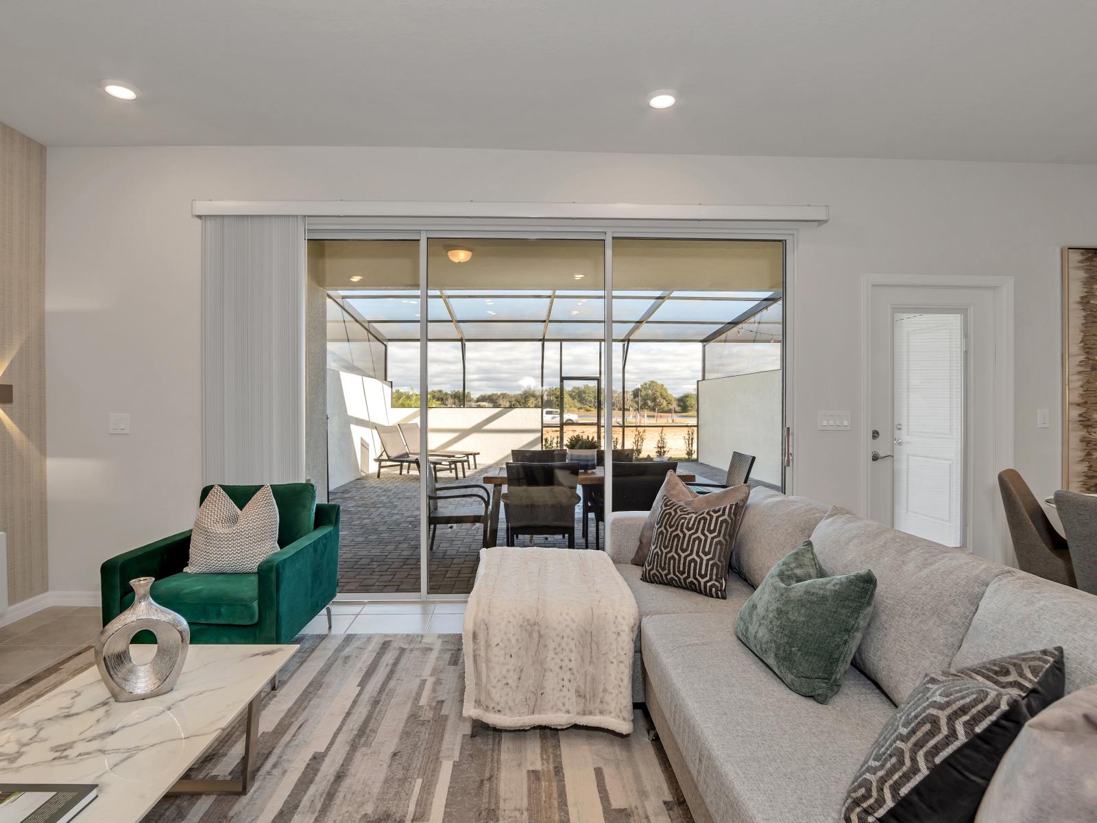 Inviting living area of the townhouse in Davenport Florida - Well-chosen lighting fixtures adding both functionality and charm - Effortlessly combines sophistication, comfort, and functionality - Elegant  finishes and refined details