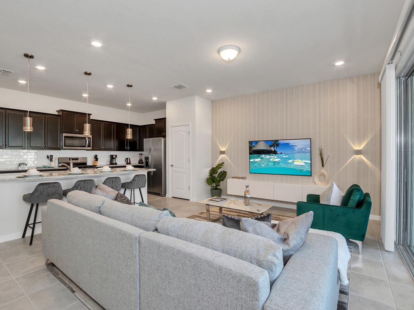 Magnificent living area of the townhouse in Davenport Florida - Elegantly decorated space with a neutral color palette for a timeless appeal - Beautiful living room with an open layout, creating a sense of spaciousness - Charming wall design