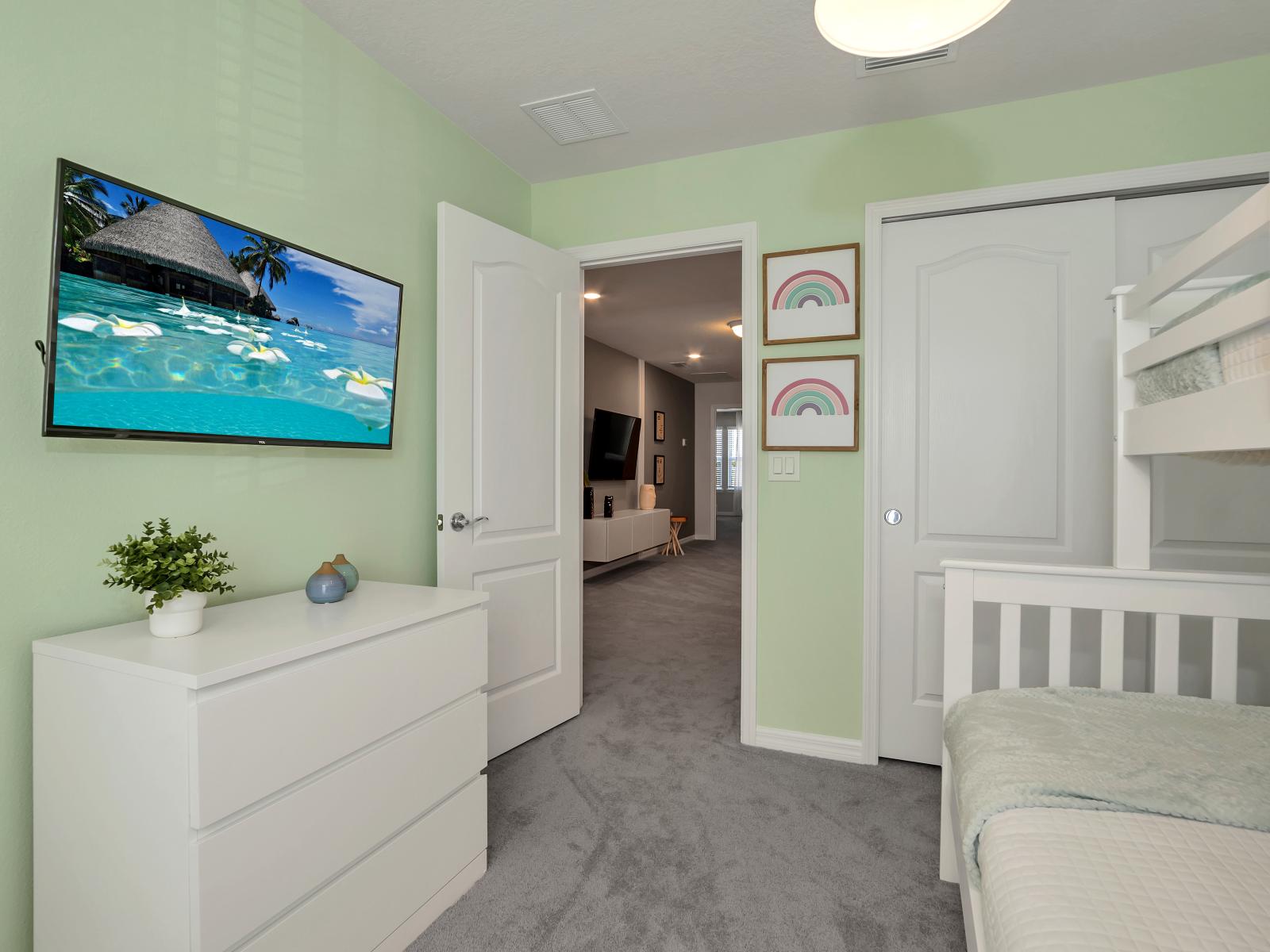 Calming bedroom of the townhouse in Davenport Florida - Adorned with Mickey Mouse themed decor - Offering one double and one single bunk bed - Smart TV for entertainment