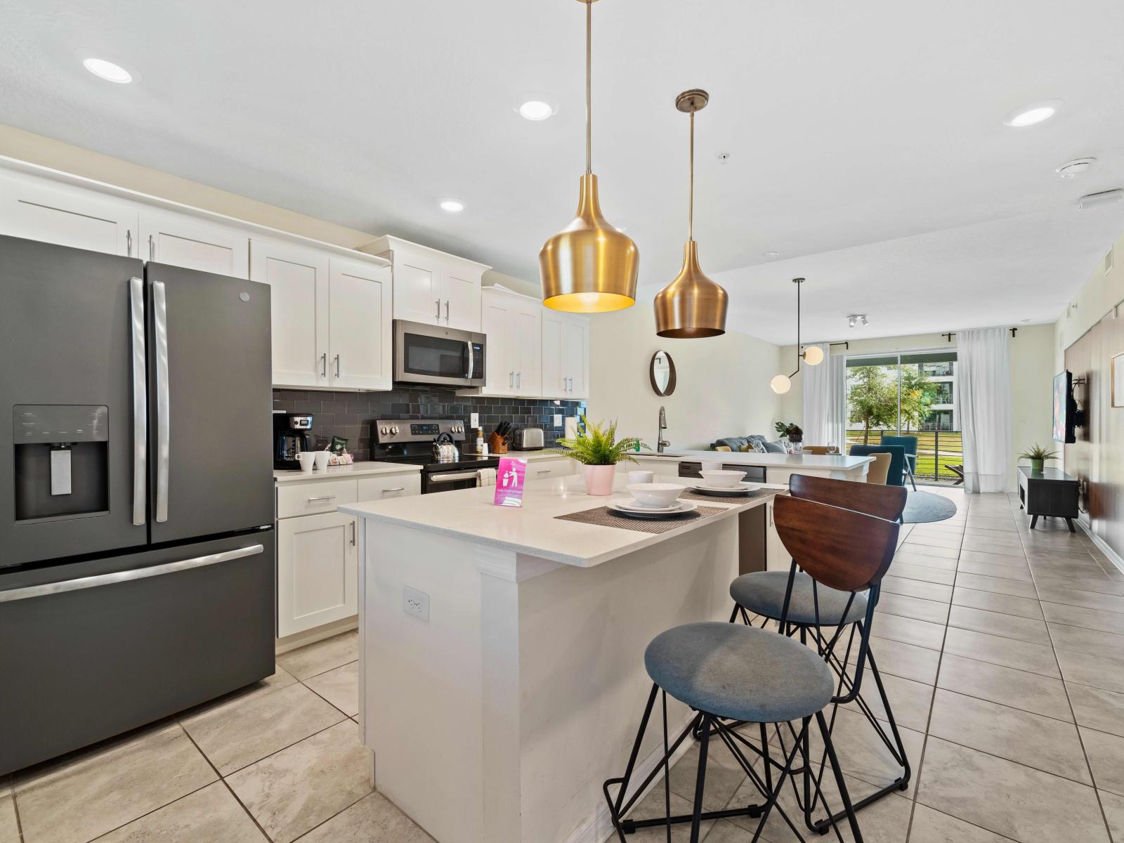 Sleek kitchen of the Condo in Kissimmee Florida - Contemporary design with clean lines and minimalist aesthetics - Integrated appliances for a seamless and stylish appearance - Full equipped