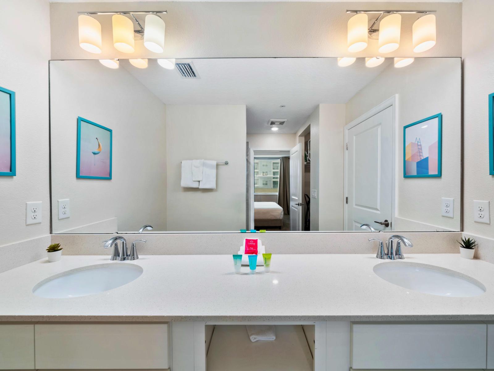 Outstanding Bathroom  of the Condo in Kissimmee Florida  - Walk-in shower Area - Lush Dual Vanity with Large Mirror - Elegant bathroom with luxurious fixtures and finishes