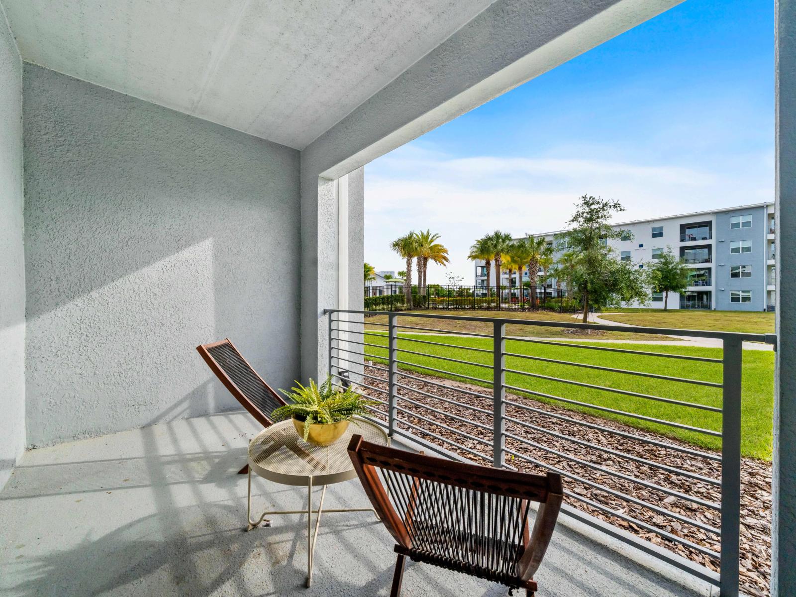 Refreshing Balcony of the Condo in Kissimmee Florida - Elevate Your Lifestyle - Experience Outdoor Living with Direct Balcony Access - Comfy seating arrangements