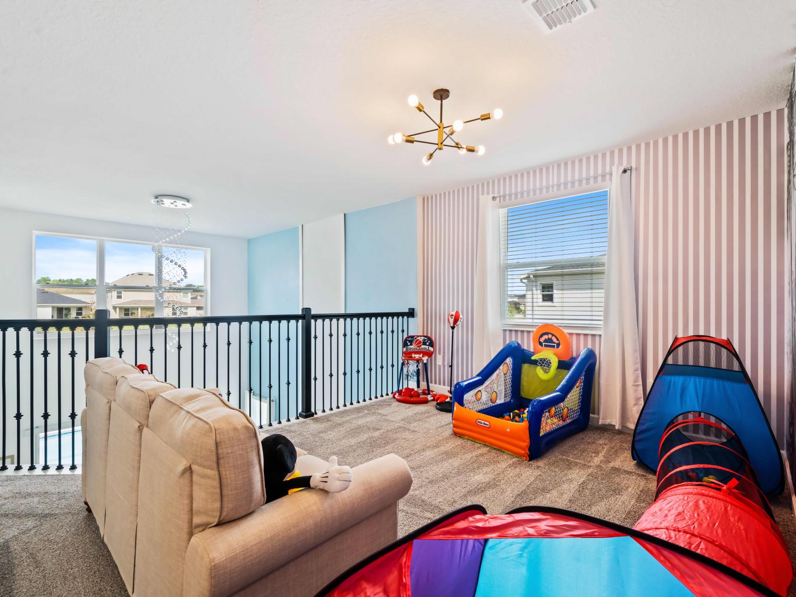 Comfy Loft area of the Apartment in Kissimmee Florida - Loft area with games for kids  - Create unforgettable memories - Cozy seating  - Elegant Lighting