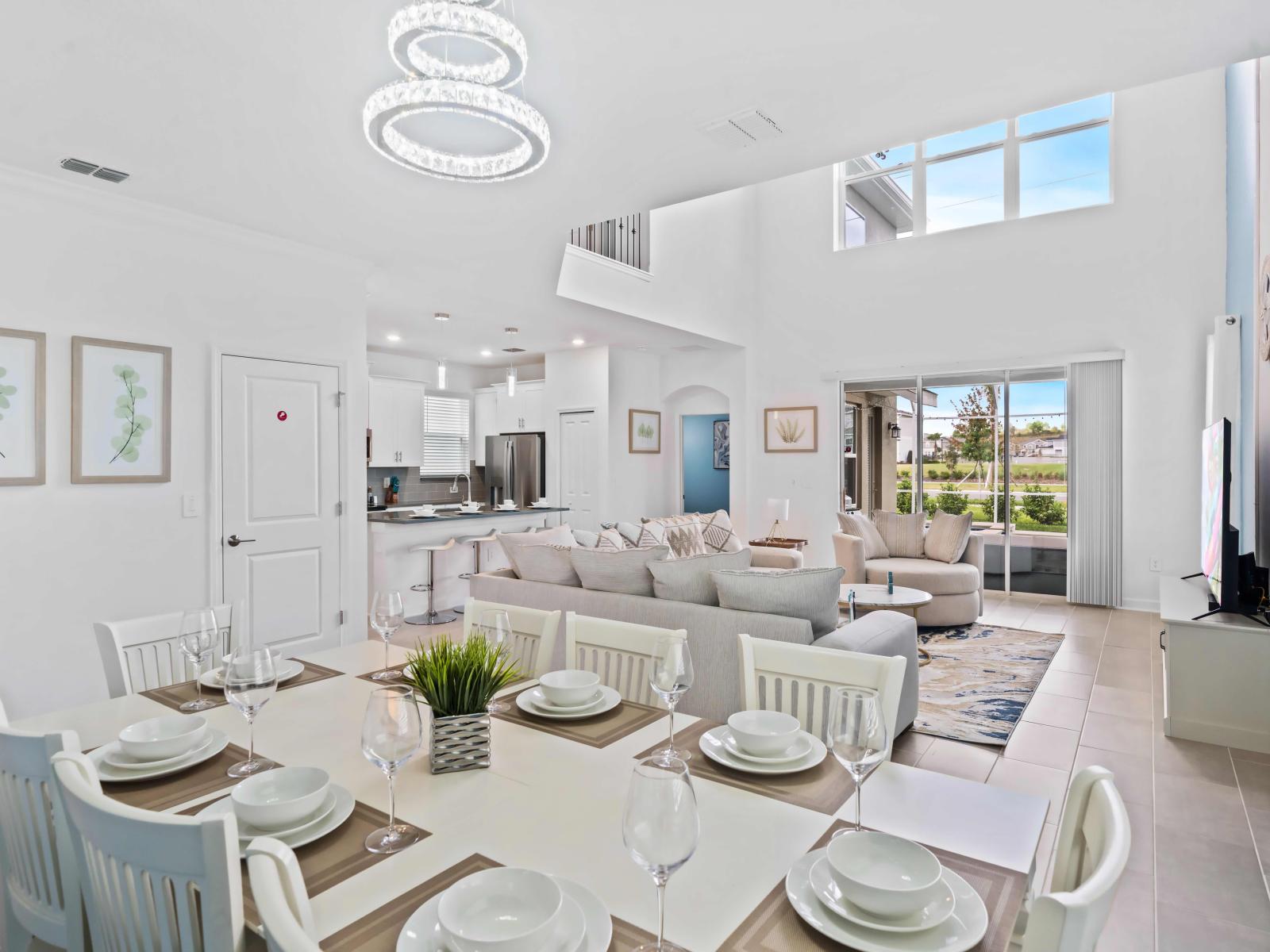 Beautiful Dining area of the Apartment in Kissimmee Florida - 8 Persons Dining - Elegant chandelier - Open-concept living area seamlessly connected to a stylish living area