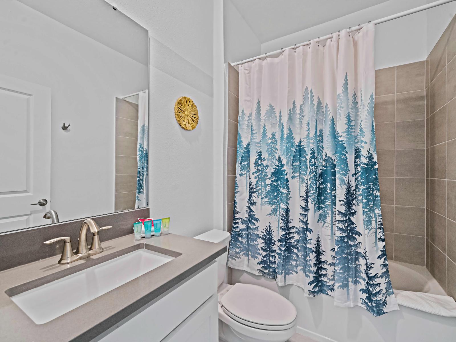 Unwind and rejuvenate in our elegant bathroom of the home in Kissimmee - Featuring a spacious bathtub with a convenient shower combo. - Experience the perfect blend of style and functionality in our modern bathroom With beautiful vanity