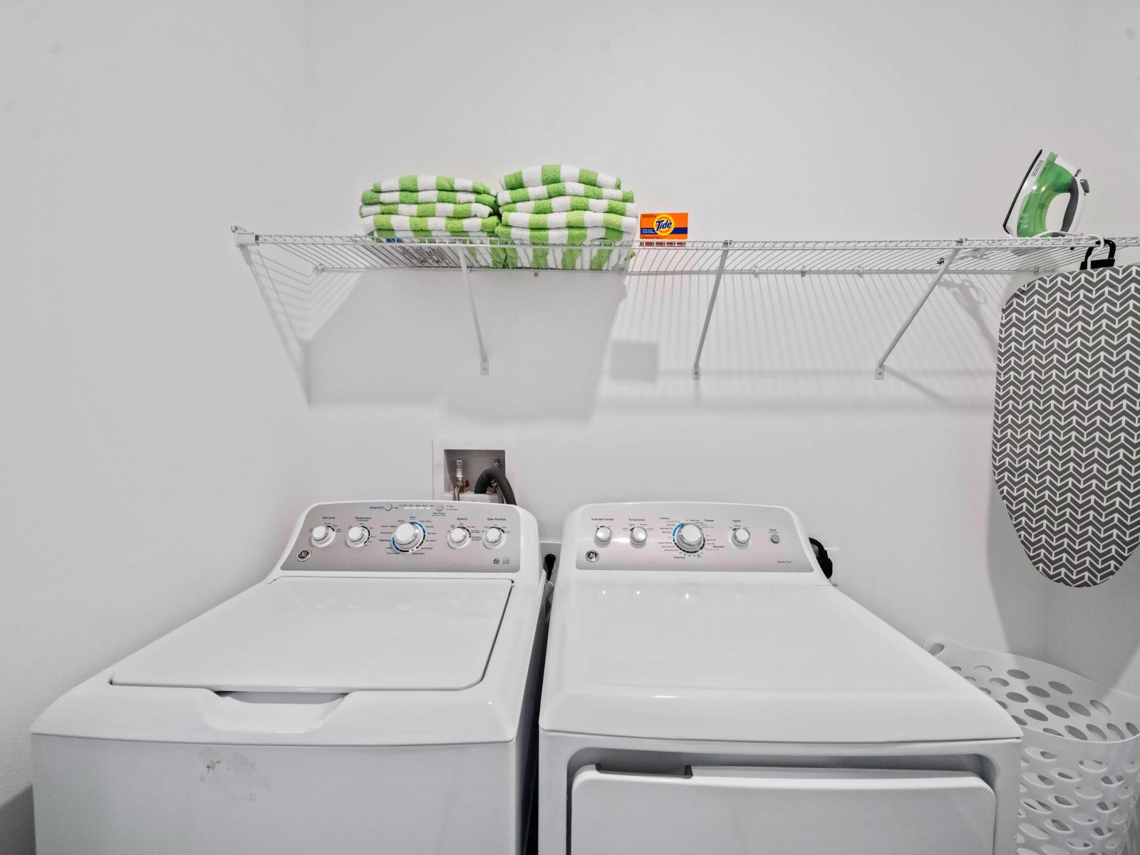 Clean laundry area of the apartment in Kissimmee Florida - Step into our laundry room - Equipped with a washer and dryer - Chores become a breeze amidst convenience and comfort