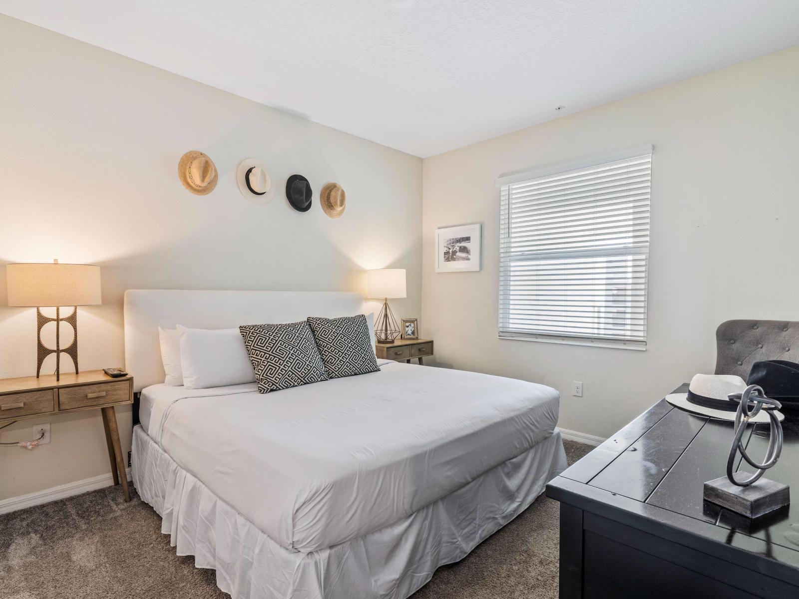 Exquisite Bedroom  of the Condo in Kissimmee. - Elegantly decored walls - Comfy Double Bed with neat and clean linen - Elite Side table lamps - Stunningly located window with outside views - TV and Netflix available