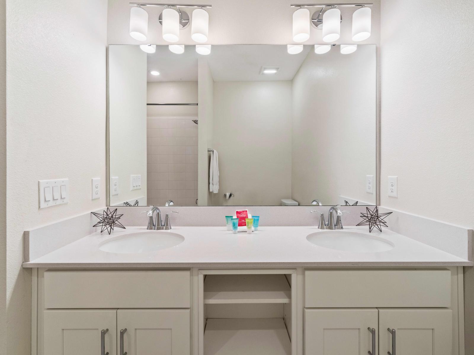 Classical Bathroom of the condo in Kissimmee - Neat and clean toilet seat - Graceful vanity with Twin sink and sufficient storage - Availability of Bathroom amenities - Separate shower area