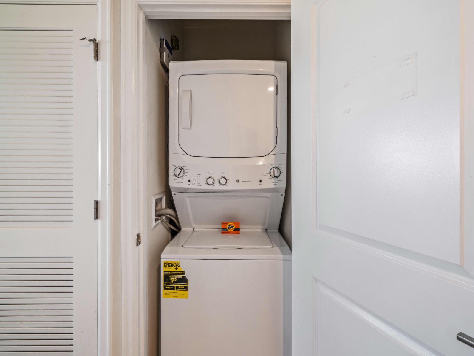 Convenient laundry area equipped with modern appliances in the condo in Kissimmee - Washer and dryer for hassle-free laundry during your stay. - Complete with laundry essentials for your comfort.