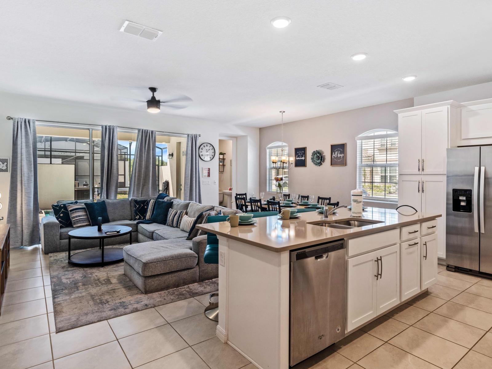 Enjoy cooking comfort in our spacious kitchen of the home in Kissimmee - Fully Equipped with all the necessary tools and amenities to create culinary masterpieces effortless - Offering modern appliances and plenty counter space for crafting meals