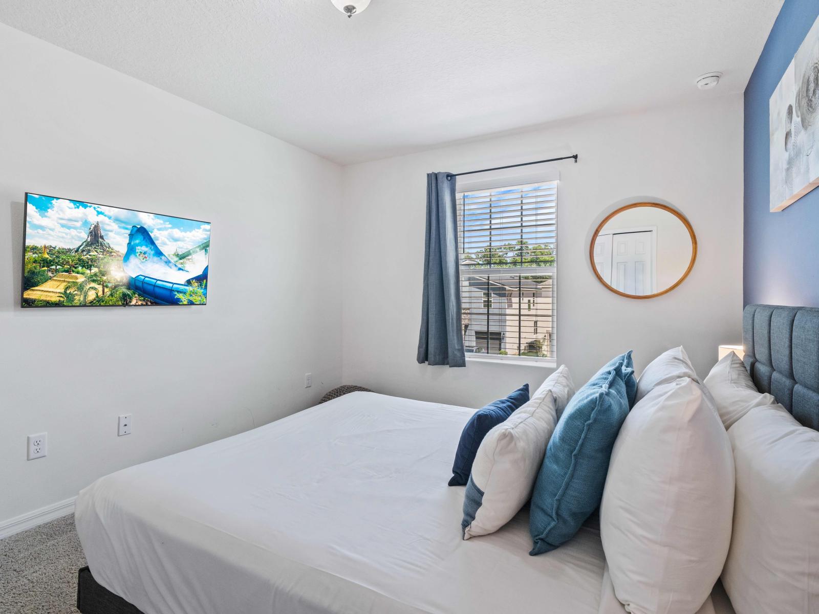 Indulge in the comfort of a generous bedroom within the Kissimmee home - Featuring a luxurious plush king-sized bed - The immaculate linens guarantee maximum comfort for your relaxation - Elegantly carpeted floor contribute to a sophistication