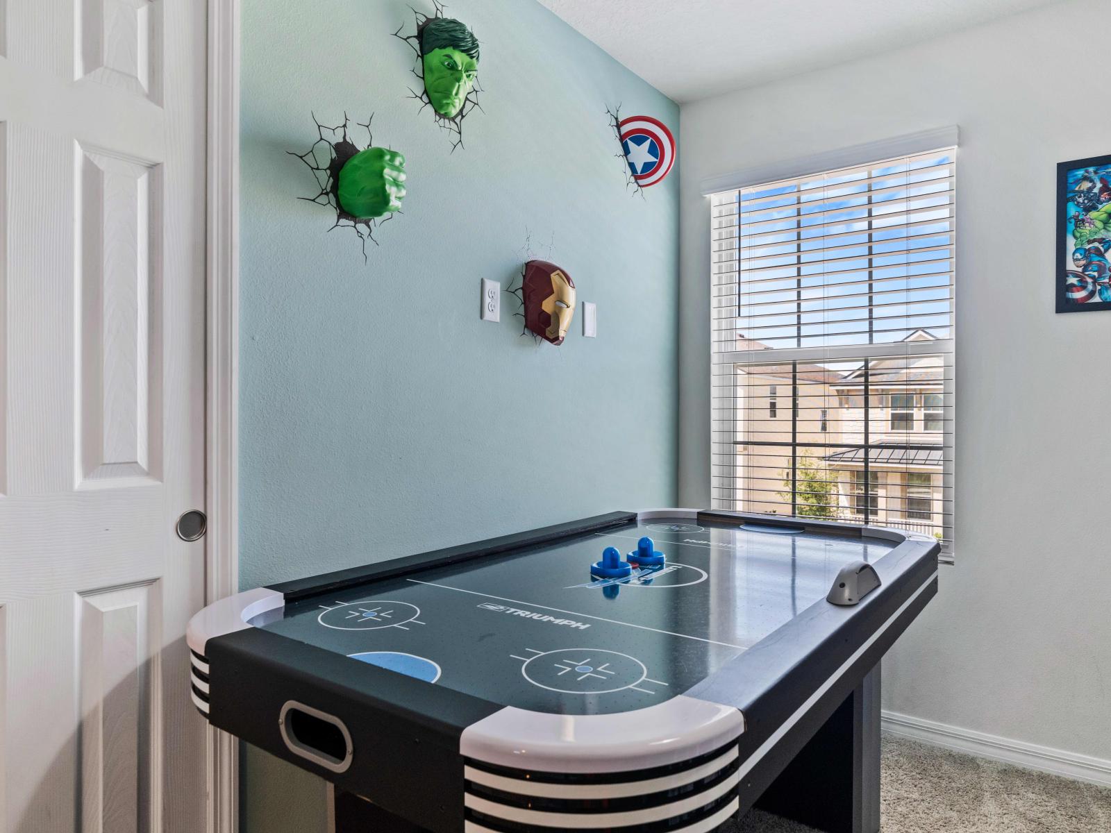 Adventurous Marvels-themed bedroom of the home in Kissimmee - Filled with cozy sleepovers in a bunk bed  - It provides air hockey table for exhilarating fun. - Immerse your kids in a Marvels-inspired bedroom