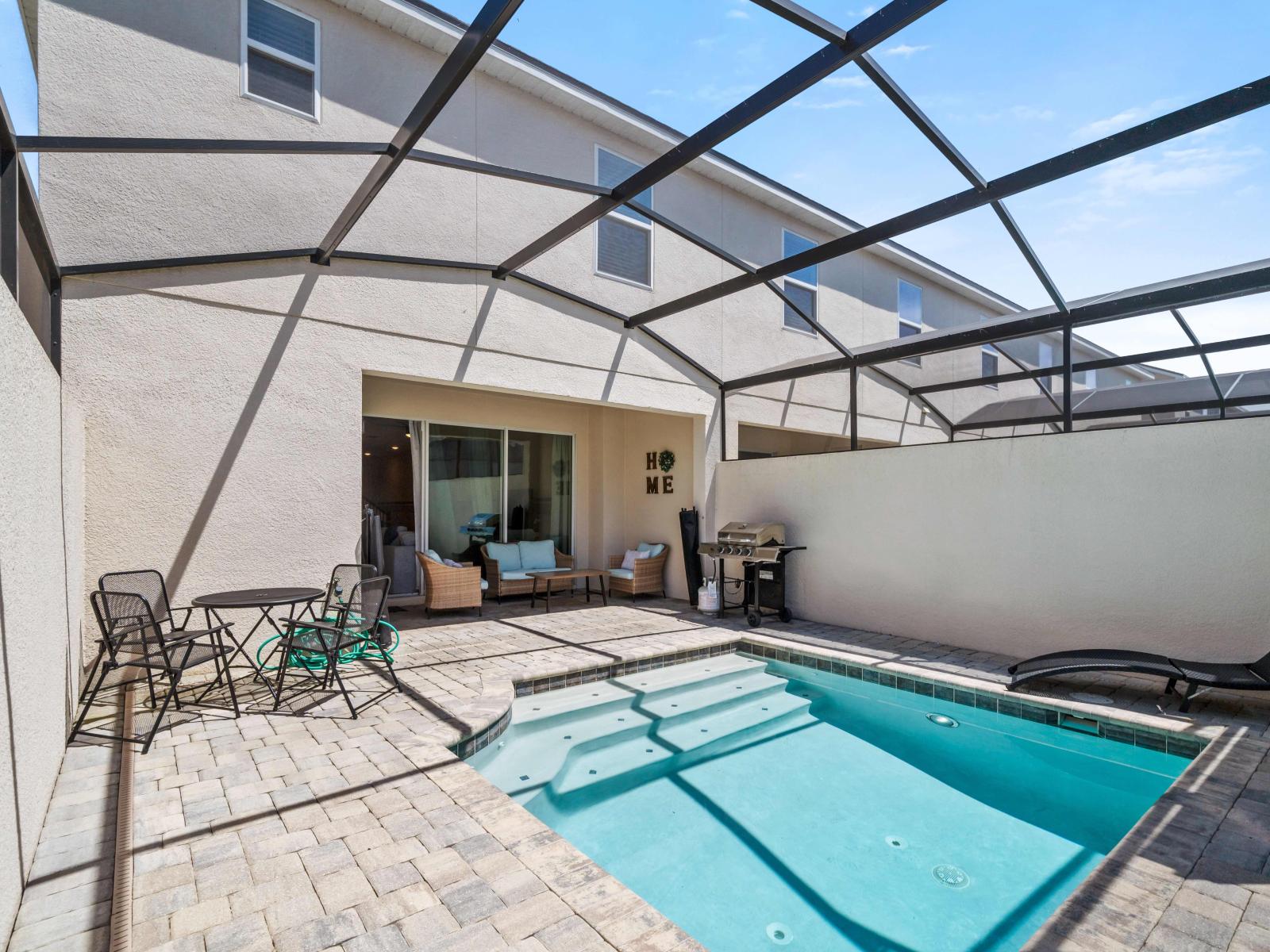 Indulge in relaxation by our private pool of the in Kissimmee - Completed with outdoor dining for moments filled with tranquility and luxury. - Experience open-air elegance around our private pool - A tropical paradise private pool and dinning