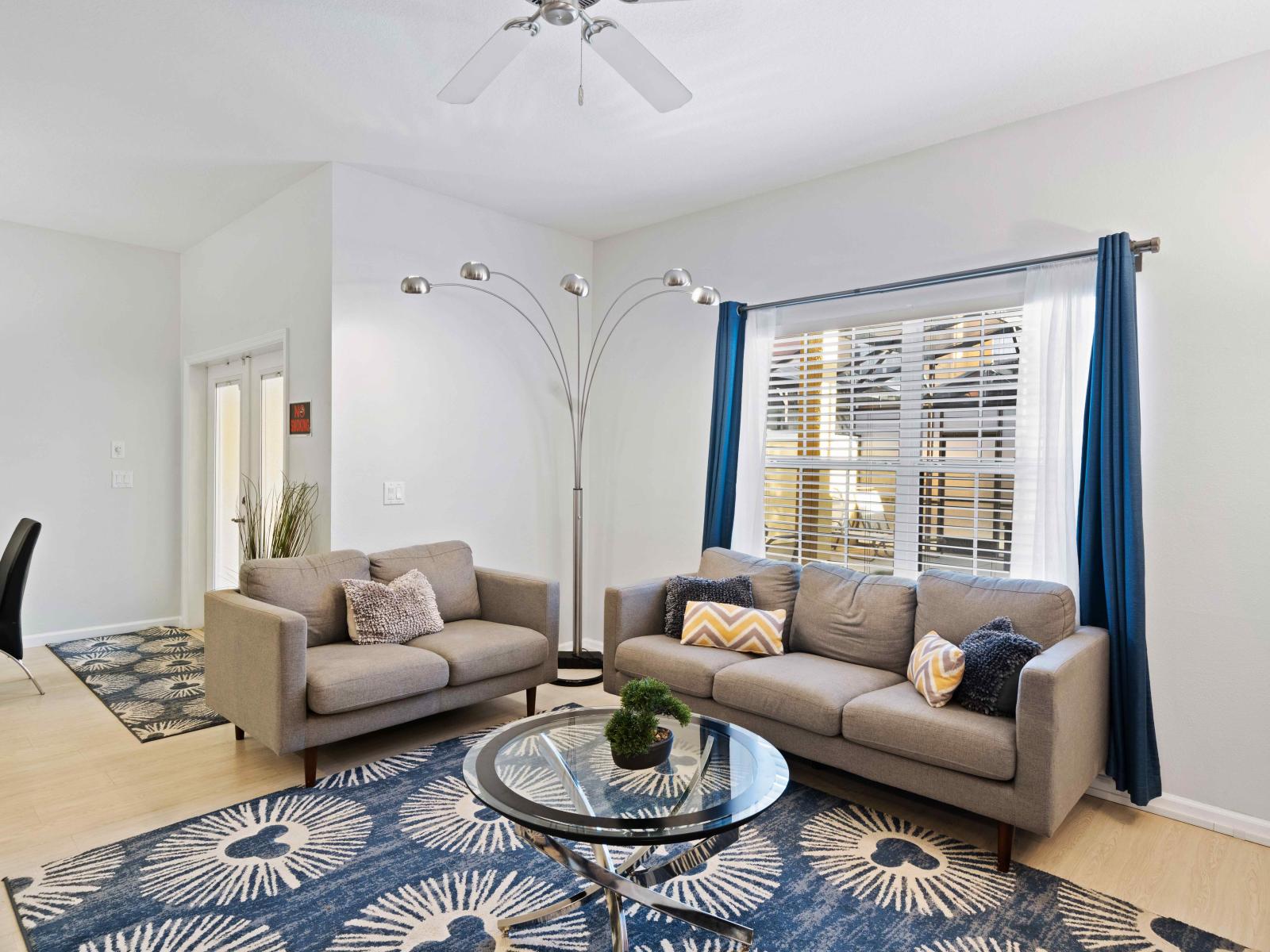 Lush Living area of the Townhouse in Kissimmee Florida - Cozy seating area conducive to relaxation and socializing - Smart TV and Netflix - Artfully arranged decor elements, from wall art to decorative accessories