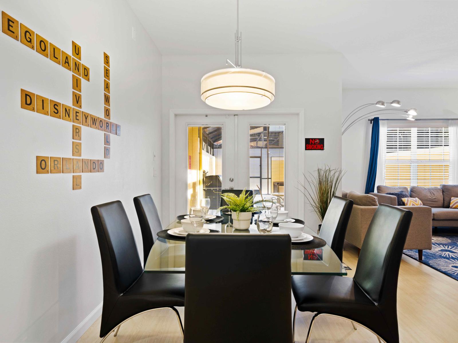 Chic Dining Area of the Townhouse in Kissimmee Florida - Functional and aesthetically pleasing tableware - Open layout seamlessly connecting the dining area to the living area