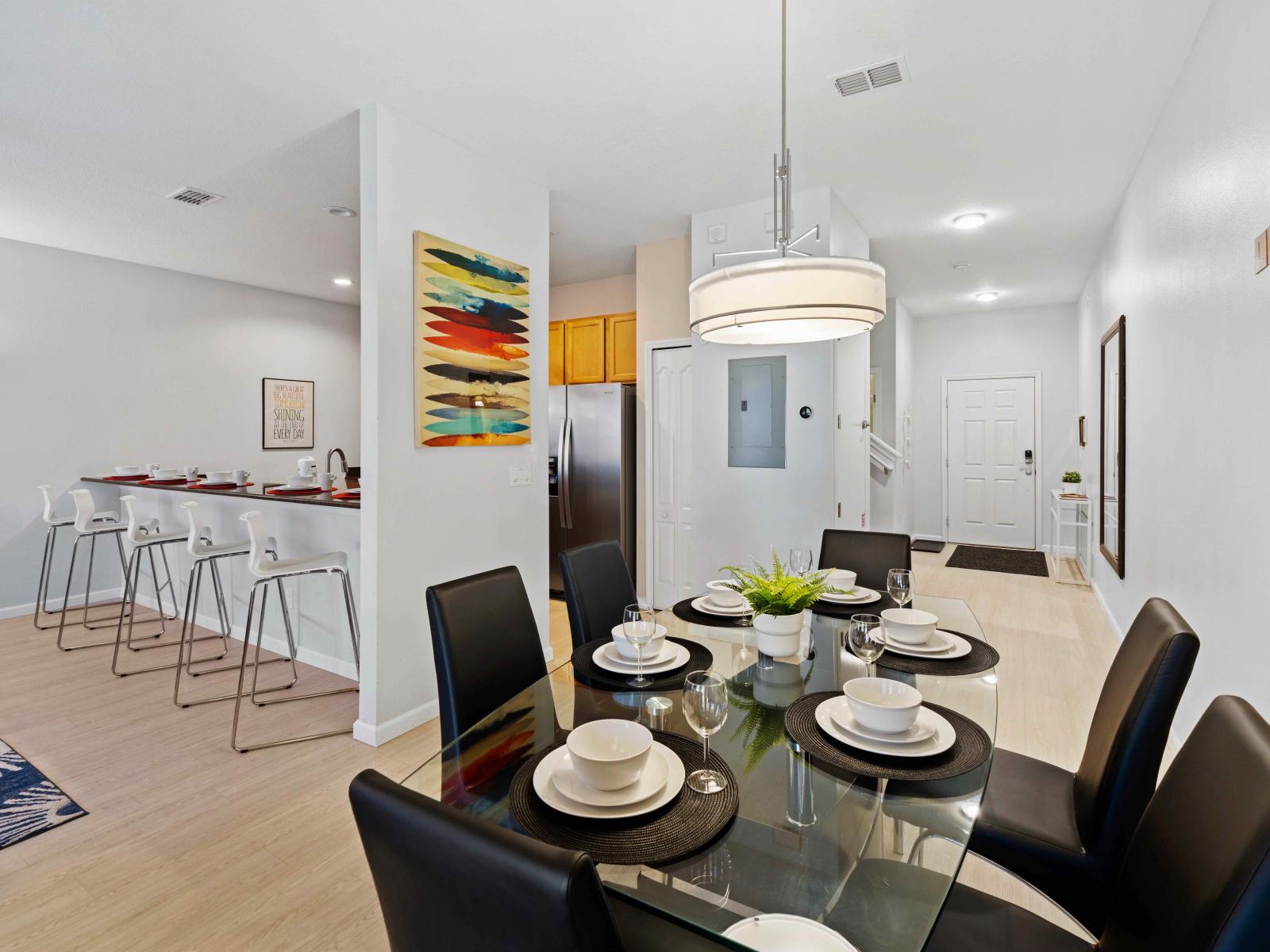 Lush Dining Area of the Townhouse in Kissimmee Florida - Thoughtful lighting fixtures creating an intimate and inviting atmosphere - 6 Persons Dining - Seamless connection to the kitchen for convenience