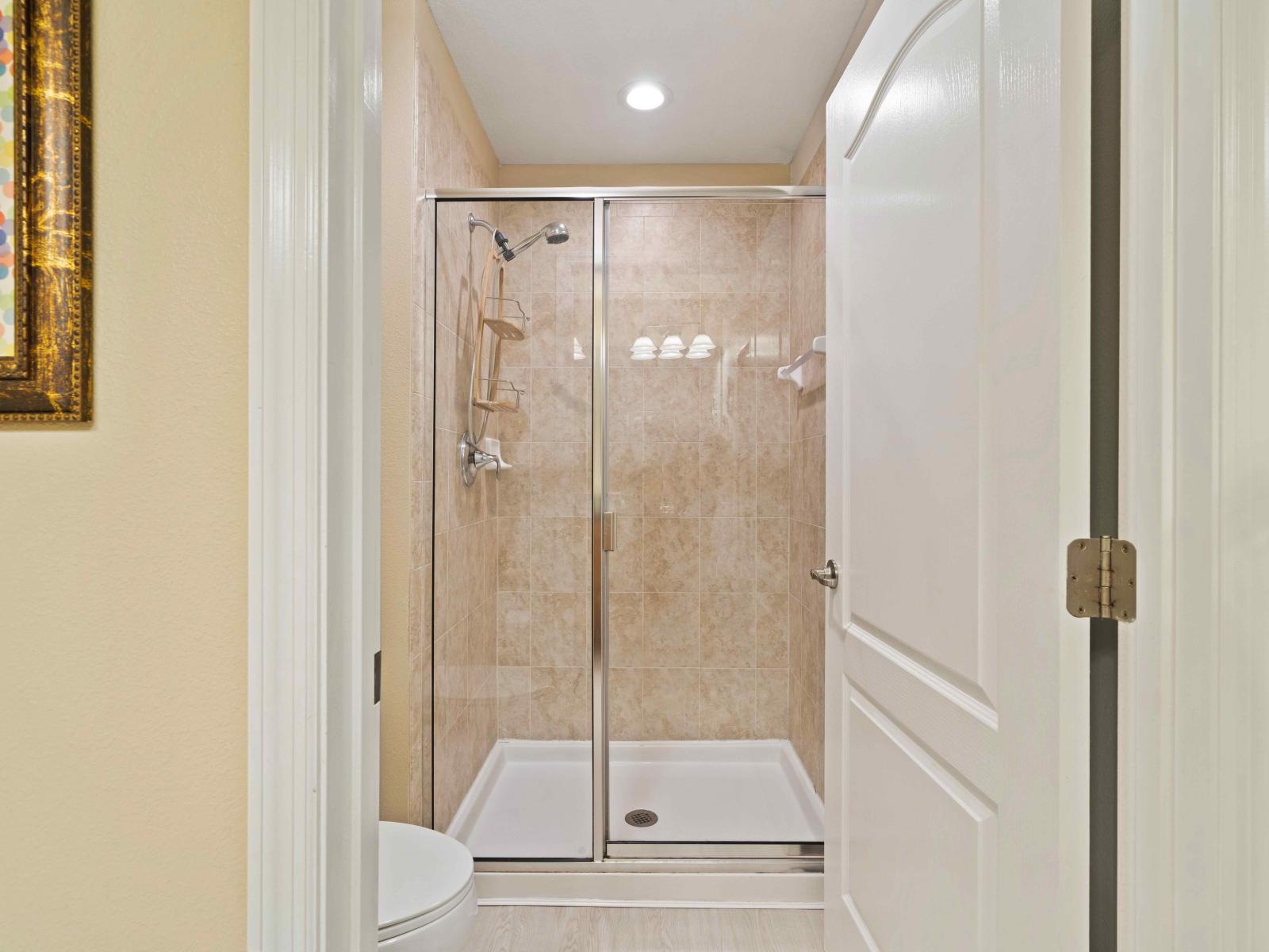 Tiled Shower Area of the Townhouse in Kissimmee Florida - Spacious walk-in shower stall - Spacious layout offering a sense of luxury and comfort