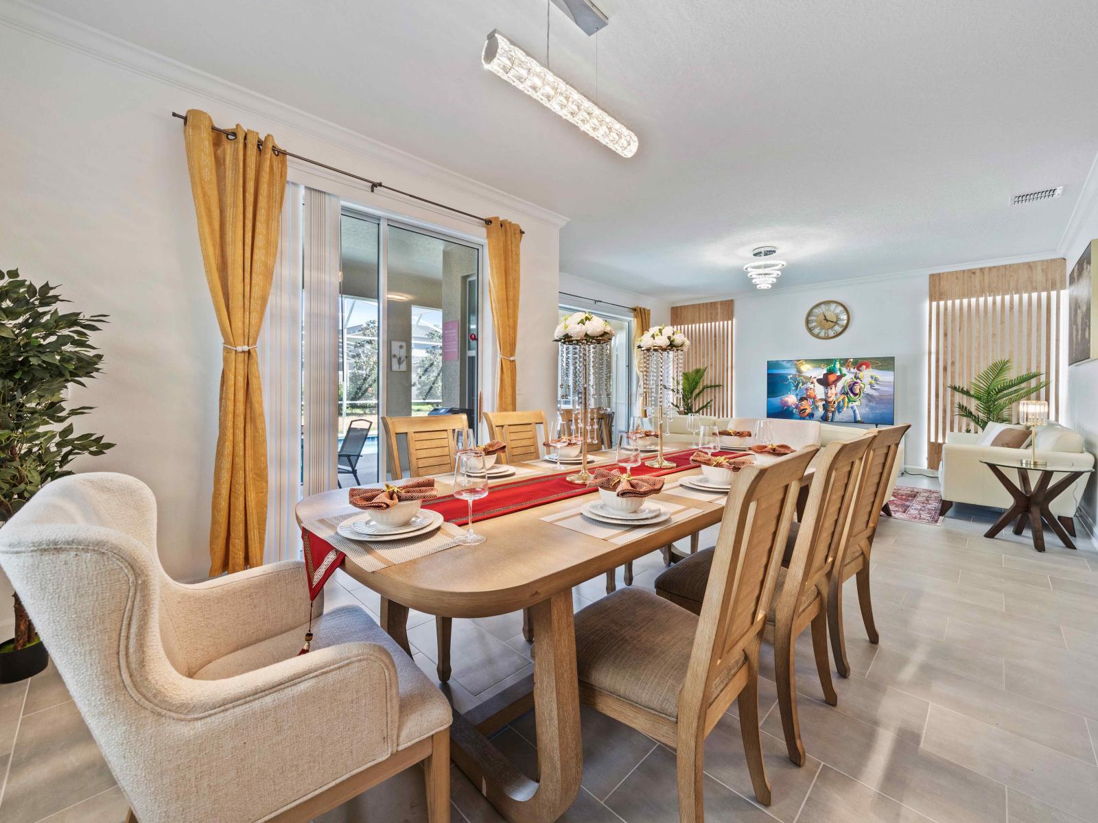 Magnificent Dining area of the home in Davenport - Spacious 8 persons dinning - Beautifully decored space with plant pots - Stunning roof lamp - Glorious large windows with pool views