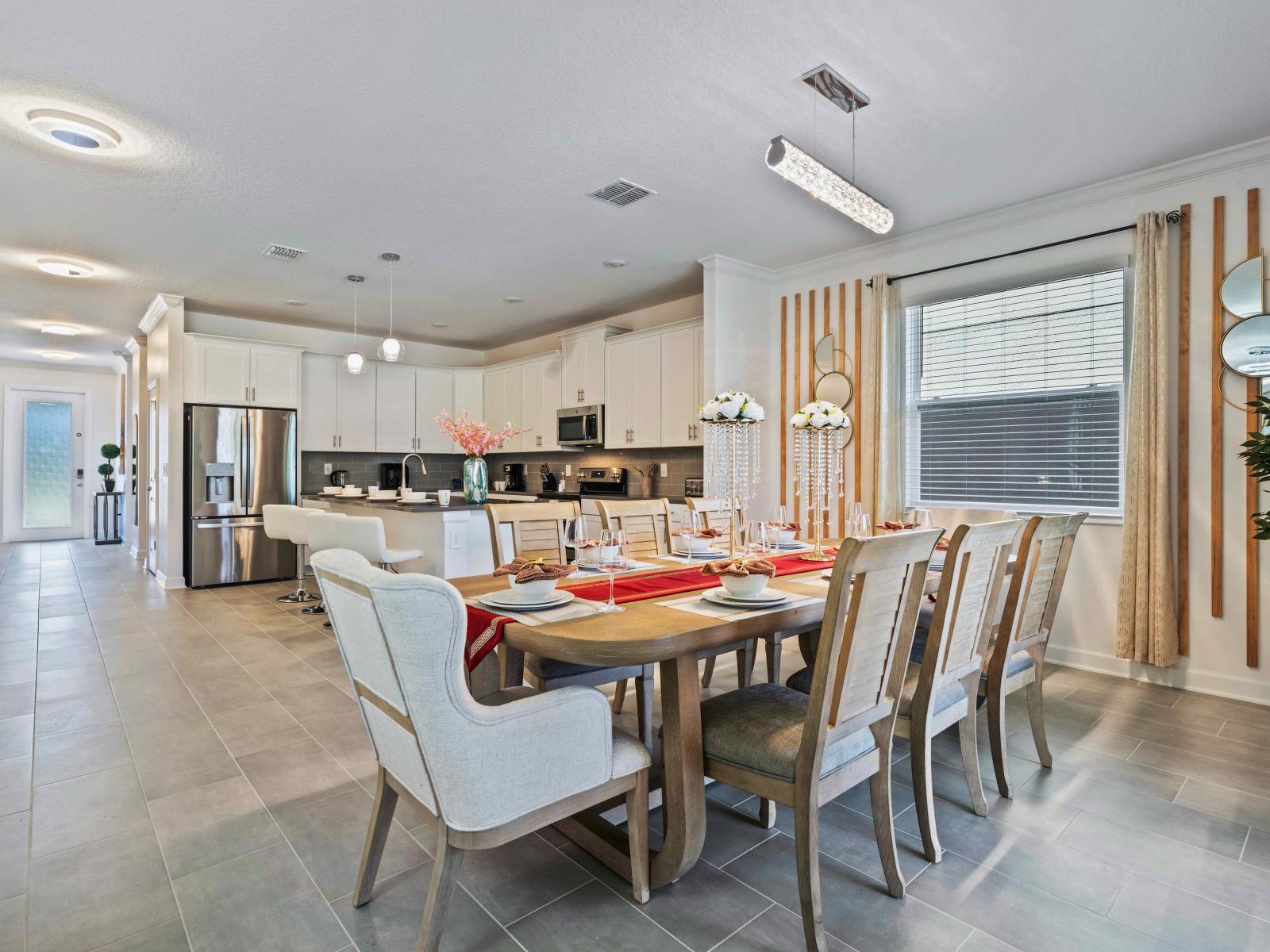 Glamorous Dining area of the home in Davenport - Sublime 8 Persons dinning - Elegantly decored space - Glorious tile furnished floor - Beautiful roof lamp - Stunning window facing dinning