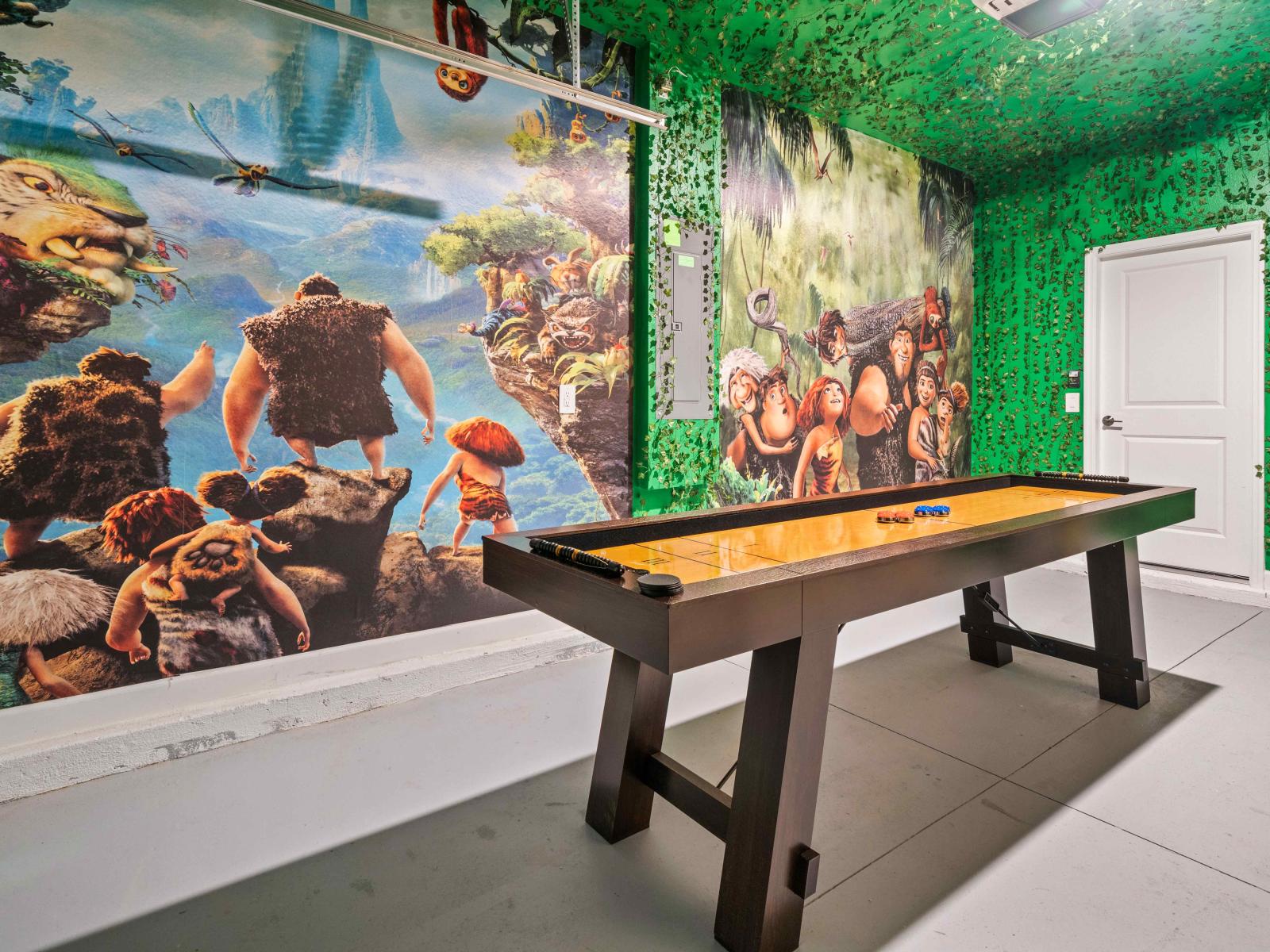 Reach new heights with our thrilling climbing wall and shuffleboard in the home in Davenport - Shuffle into fun with our classic shuffleboard - the perfect game for friendly competition - Slide into vacation bliss with our entertaining shuffleboard