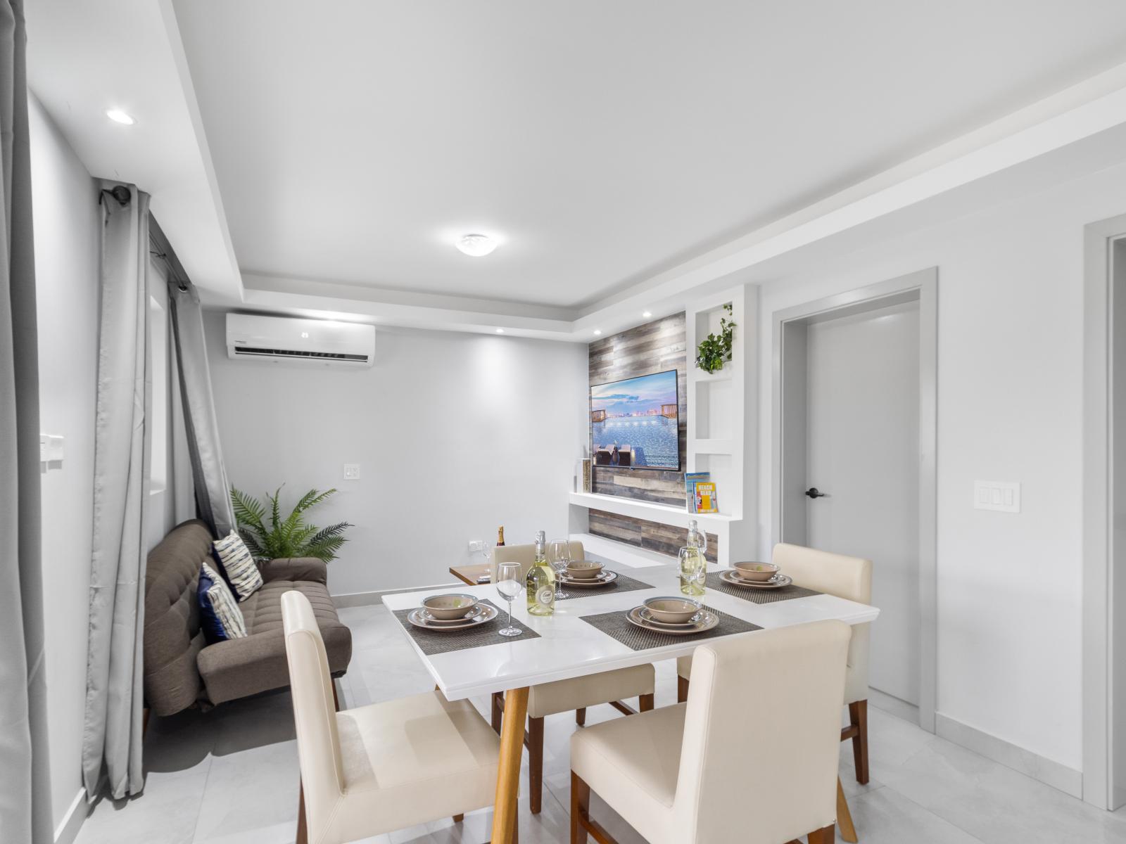 Enchanting dining area of the apartment in Oranjestad Aruba - Open-concept living area seamlessly connected to a stylish dining space - Functional and aesthetically pleasing space - Dining table for 4 persons