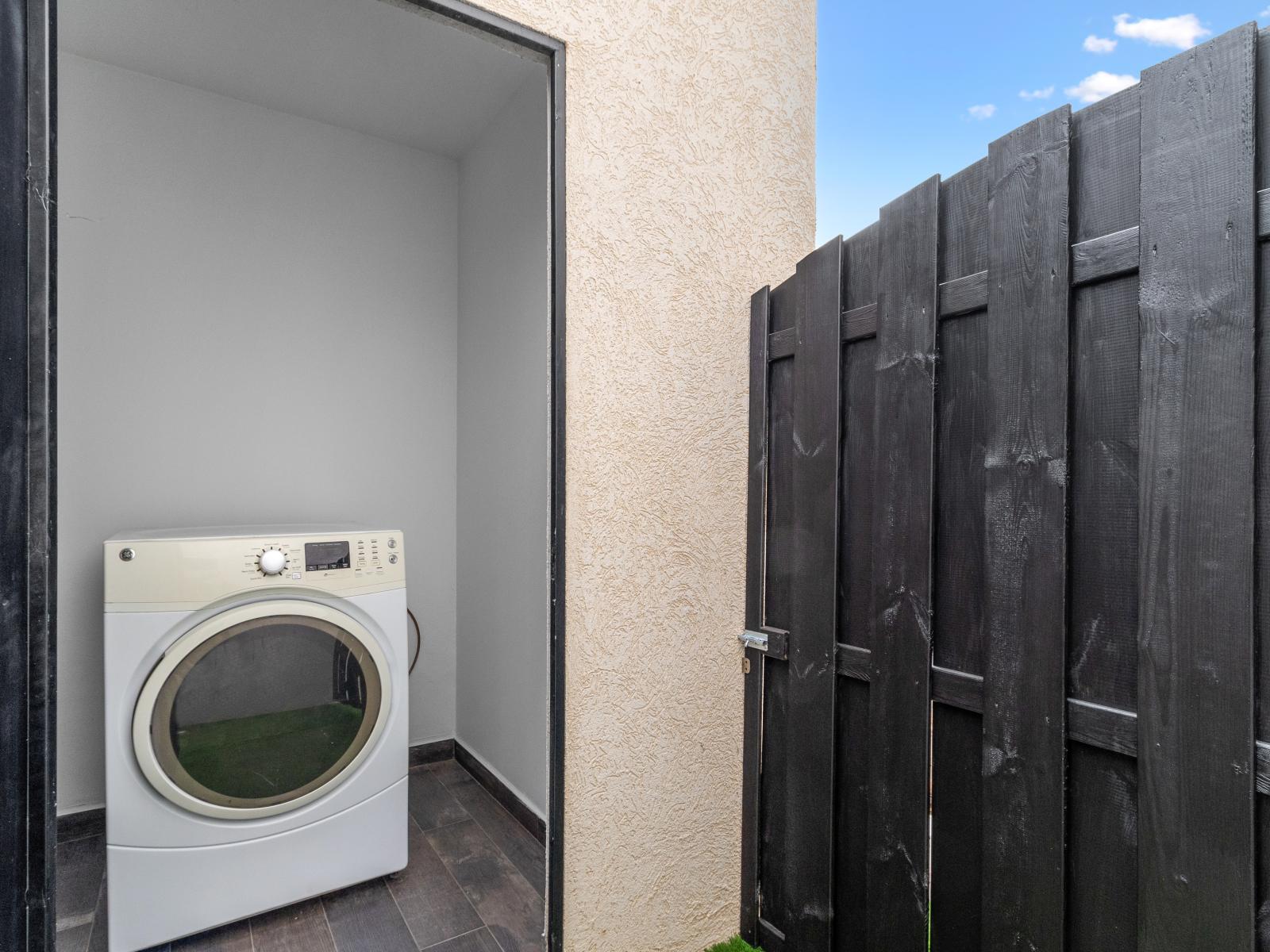 Shared laundry area of the apartment in Oranjestad Aruba - Stay organized and efficient a thoughtful convenience - Maintain a fresh wardrobe with our accessible laundry facilities