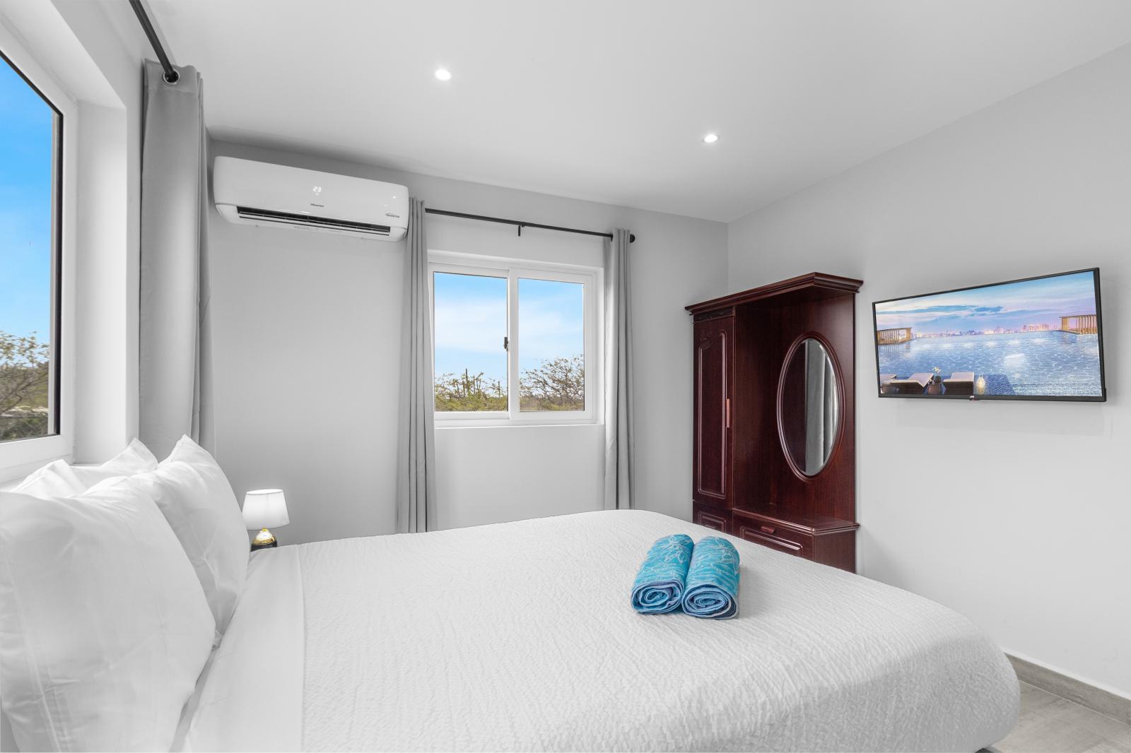 Elegant bedroom of the apartment in Oranjestad Aruba - Smart use of space with efficient storage solutions - Thoughtfully designed bedroom featuring functional and stylish furniture