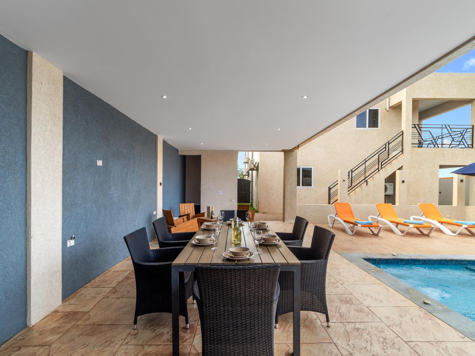 Magnificent outdoor shared dining area of the apartment in Oranjestad Aruba - Savor the flavors of paradise with a side of poolside serenity - Outdoor dining experience offers a feast for the senses - Every meal accompanied by stunning pool views