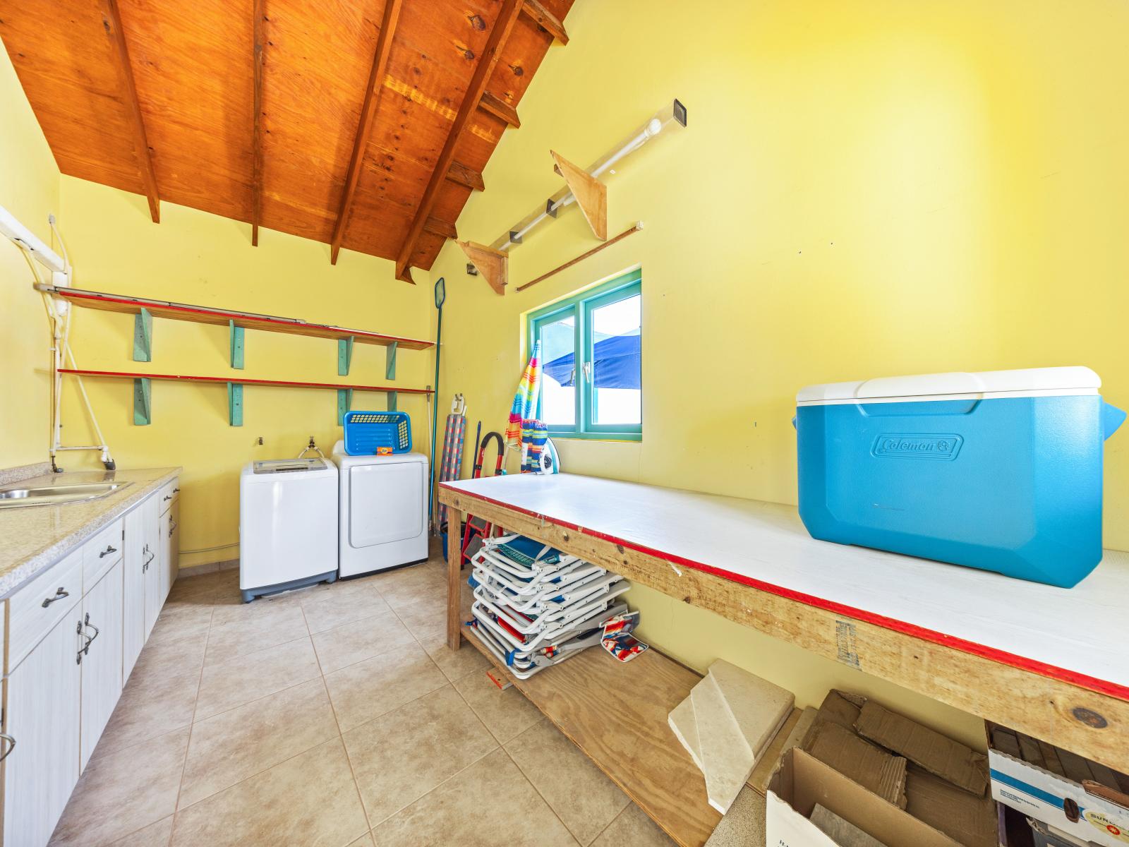 - Spacious laundry area with washer and dryer for convenient vacation cleaning - Plenty of storage and workspace for beach gear or other items you need to keep organized - Bright and airy, with easy access to the outdoors, making laundry a breeze