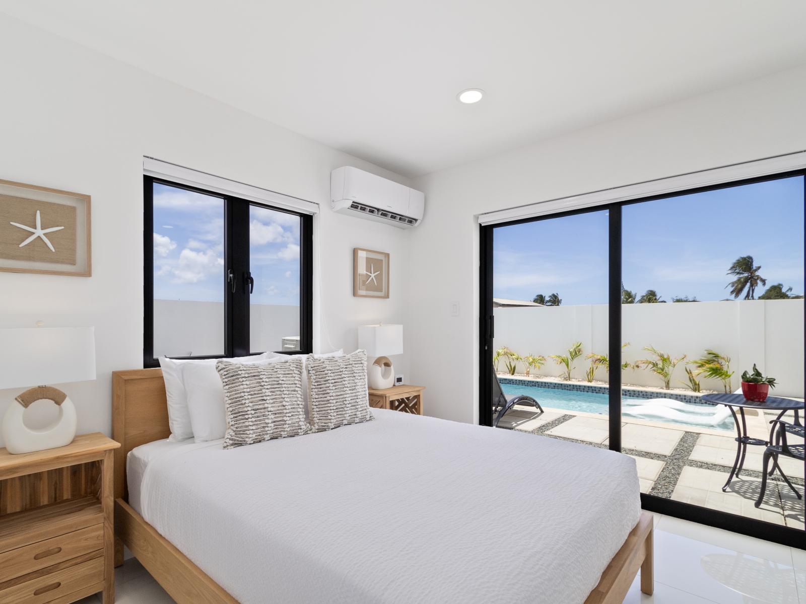 Magnificent bedroom of the home in Oranjested Aruba - Features a queen size bed for relaxing nights - Access to the backyard with pool and seating