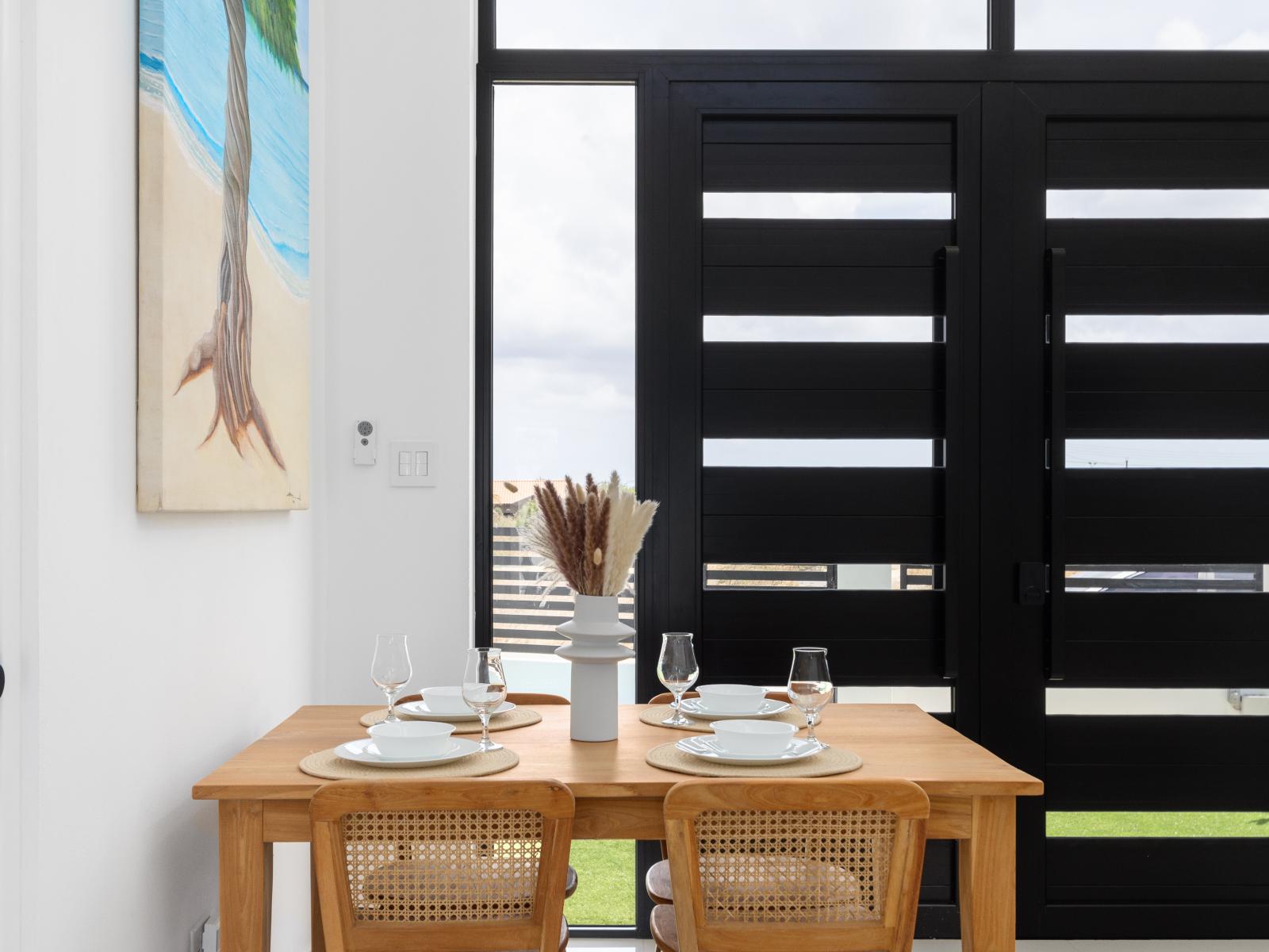 Lush dining area of the home in Oranjested Aruba - Enjoying delicious meals with family and friends - 4 Persons dining - Sophisticated design with a blend of modern and classic elements