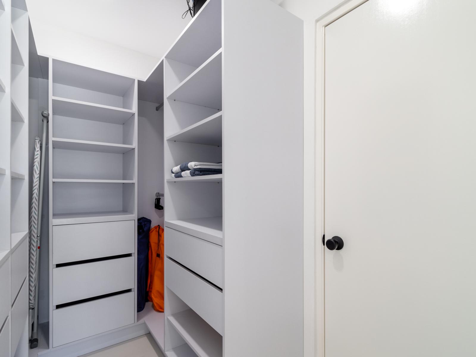 Walk in closet of the home in Oranjestad Aruba - Adorned with a versatile storage solutions - Plenty of space for all of your belongings - Store and organize as you want