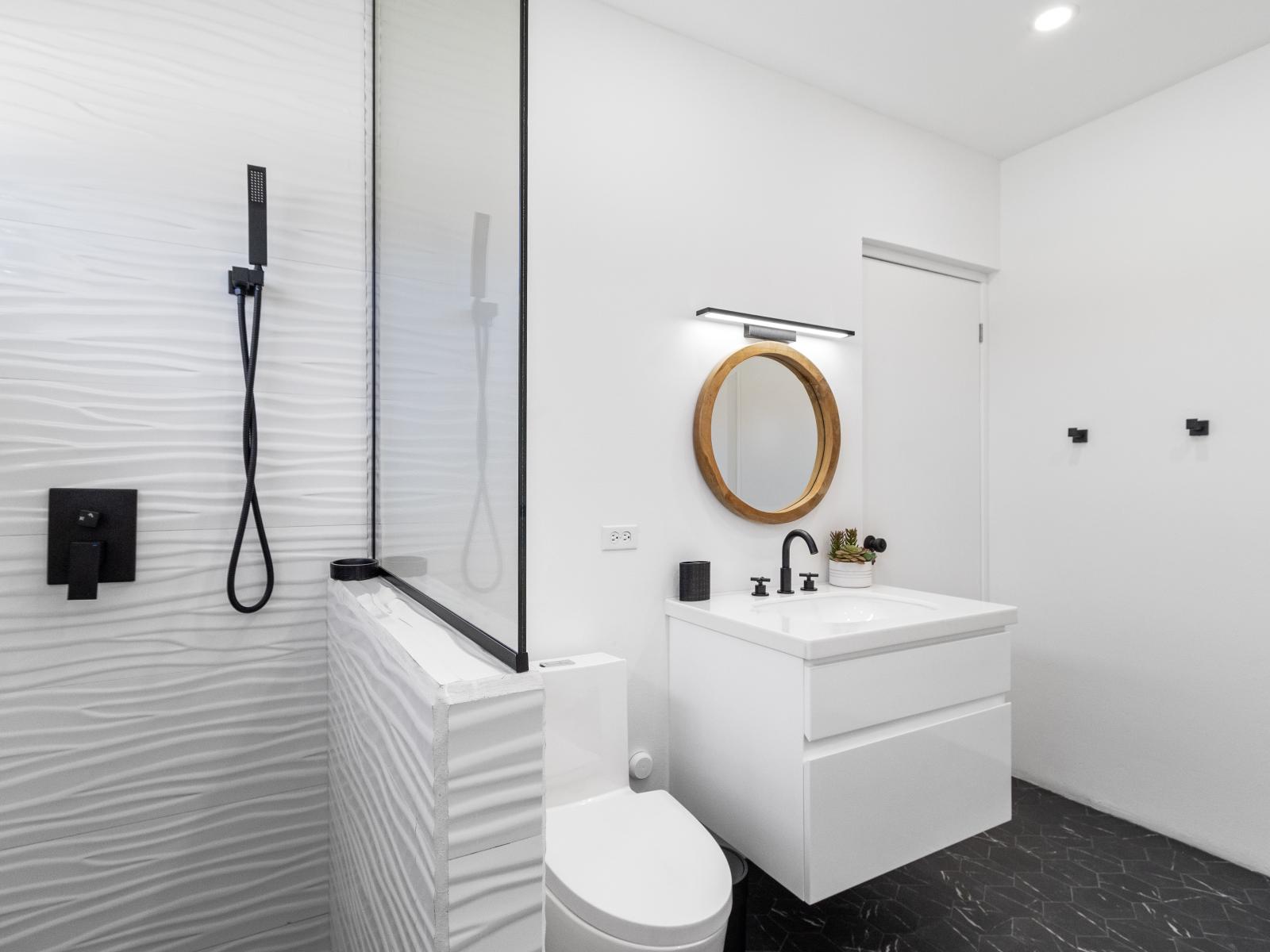 Elegant bathroom of the home in Oranjestad Aruba - Walk in shower with modern finishes  - Experience Pure Comfort