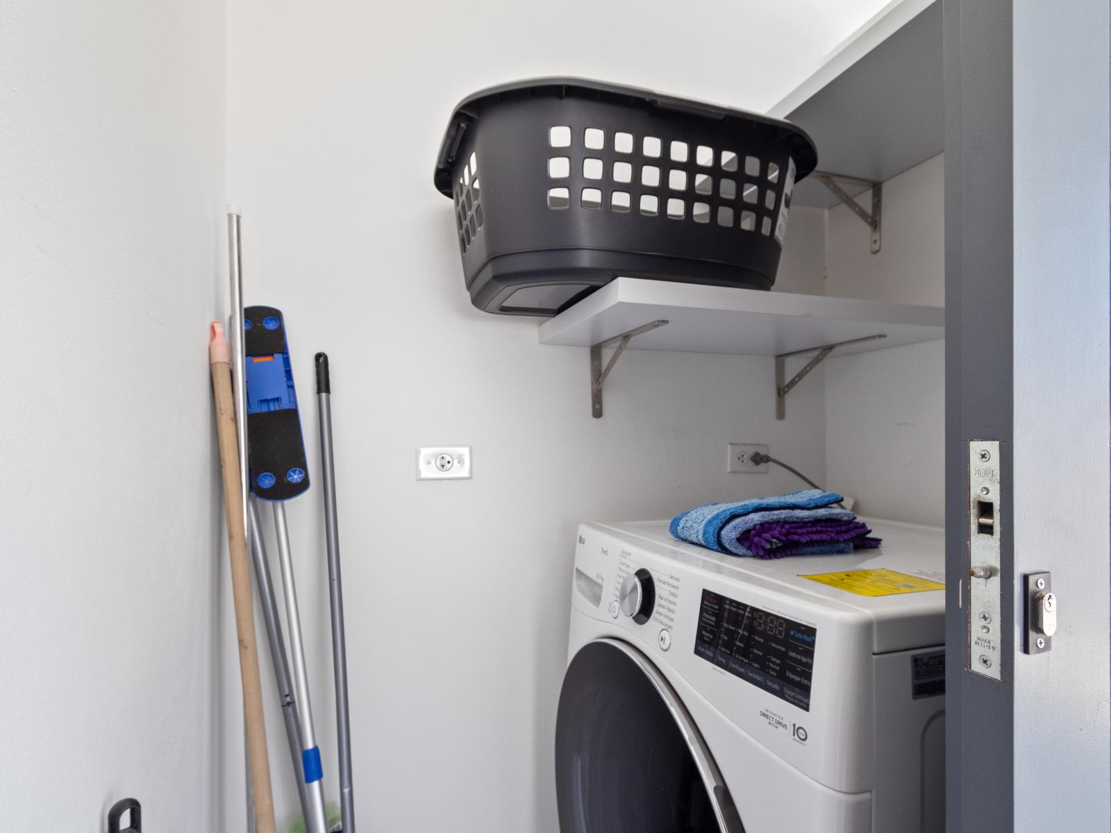 Laundry room of the home in Oranjestad Aruba - Modern washer and dryer combo  - Streamline your laundry routine - Embrace the convenience of keeping your clothes fresh and clean