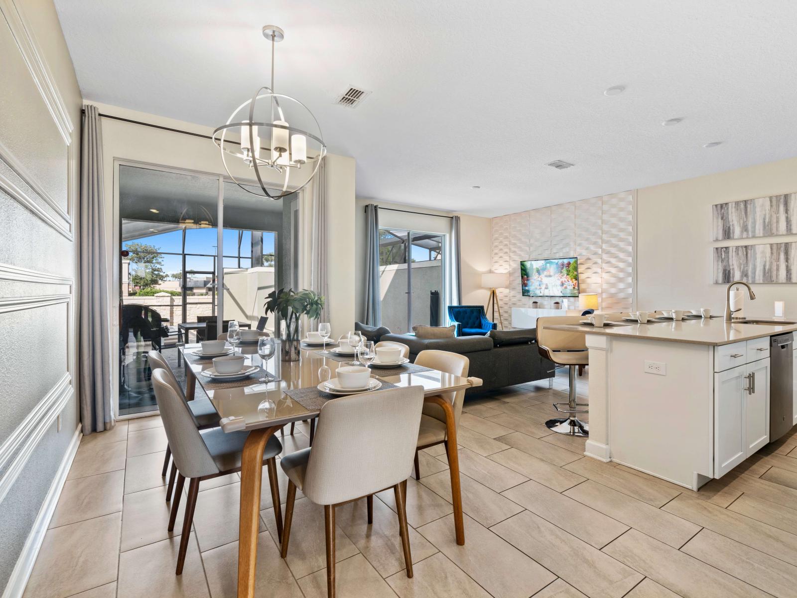 Elegant dining area of the townhouse in Kissimmee Florida - 8 persons dining - Sophisticated design with a blend of modern and classic elements - Open layout seamlessly connecting the dining area to the kitchen and living area