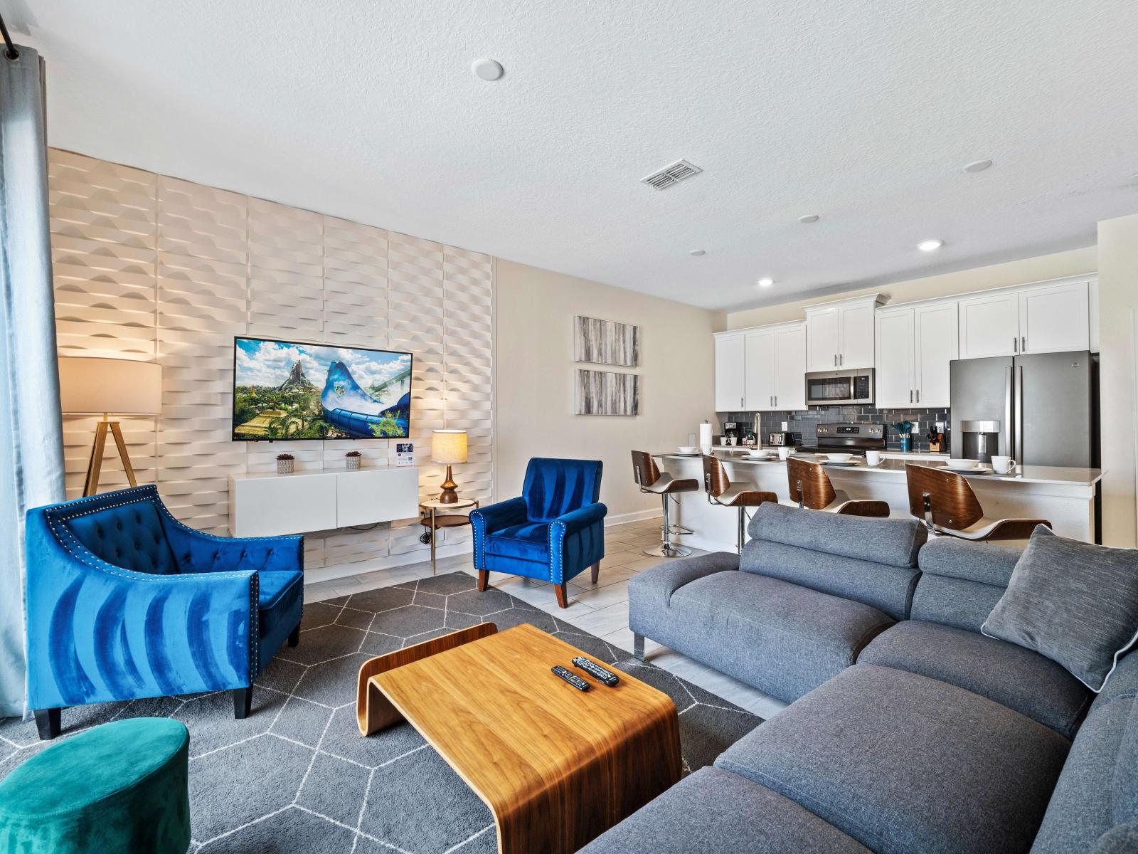 Inviting living area of the townhouse in Kissimmee Florida - Elegantly decorated space with a neutral color palette for a timeless appeal - Natural light floods the room, enhancing its warmth and inviting atmosphere