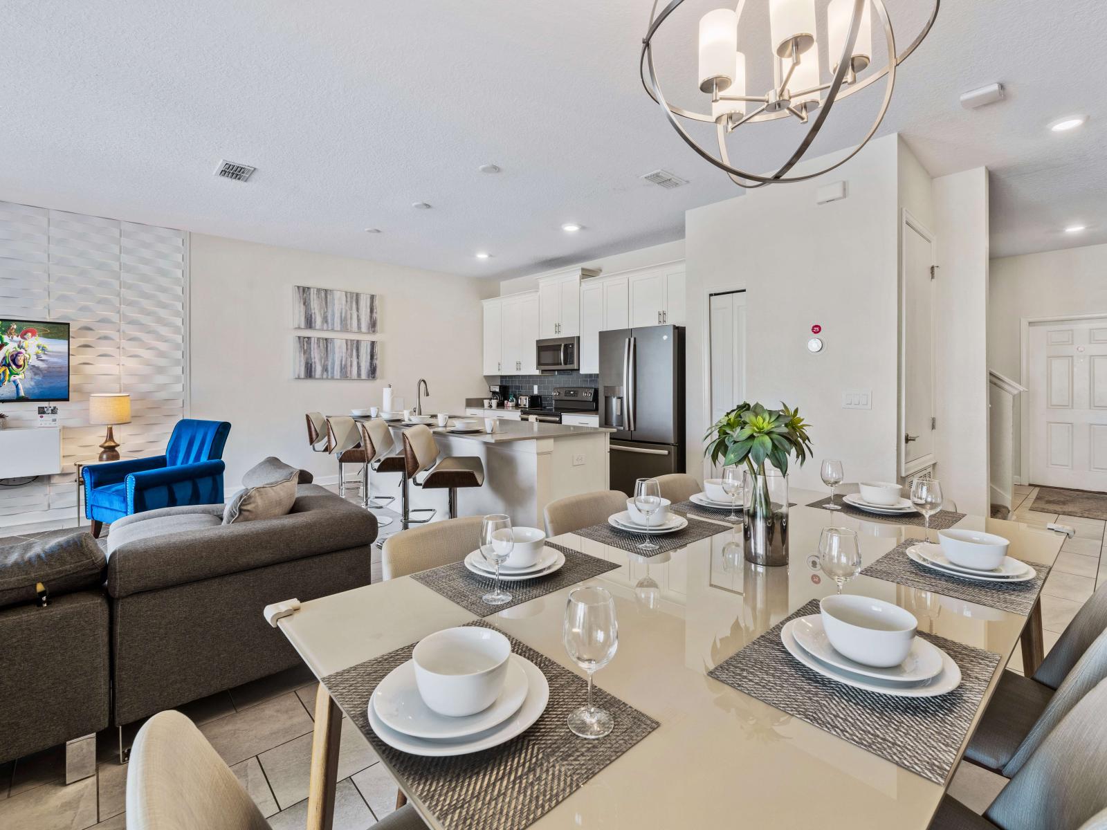 Thoughtfully designed townhouse in Kissimmee Florida - Open layout seamlessly connecting the dining area to the kitchen and living area - Plush and comfortable seating arrangements - Flexible seating options for comfort and adaptability