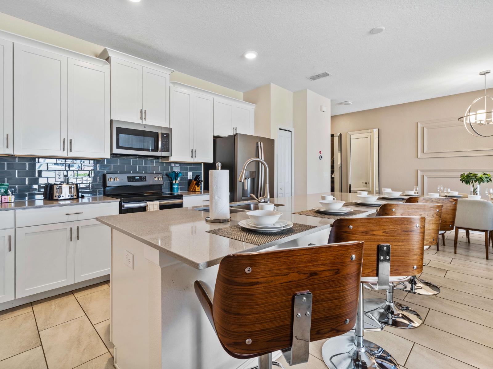 Chic kitchen of the townhouse in Kissimmee Florida - Seamless connection to the dining area for convenience - Full equipped - Stainless steel appliances